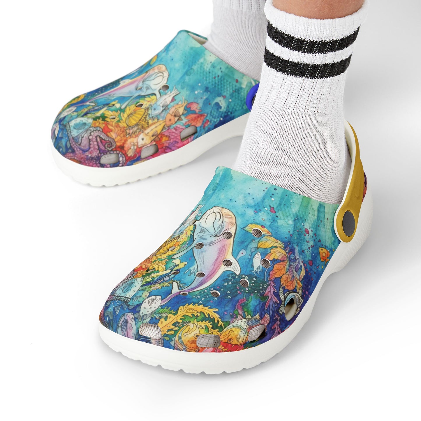 Kids slip-on reef print clogs worn with white socks; white outsole and yellow heel accent.