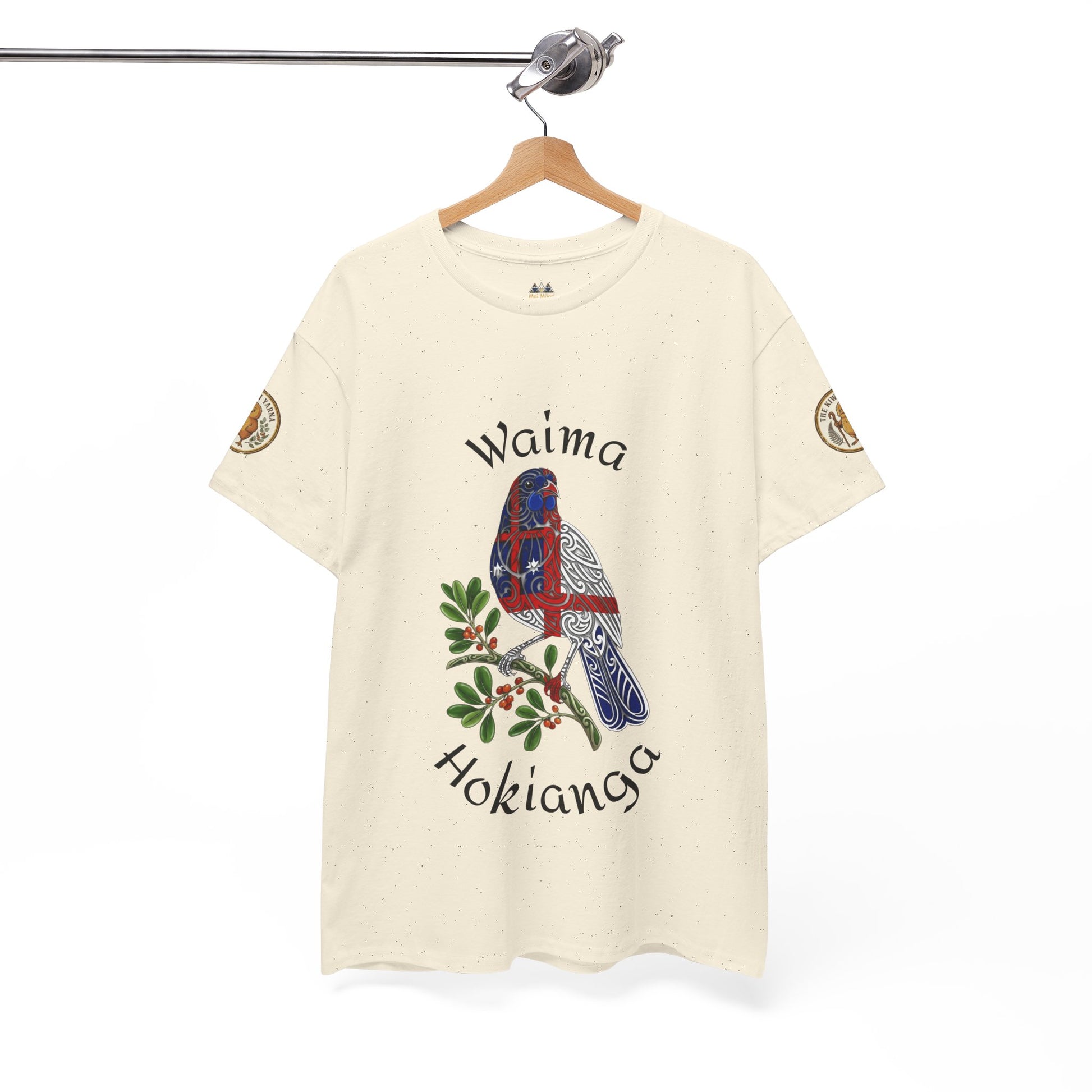 Cream graphic T-shirt on hanger with bird-and-leaves front design