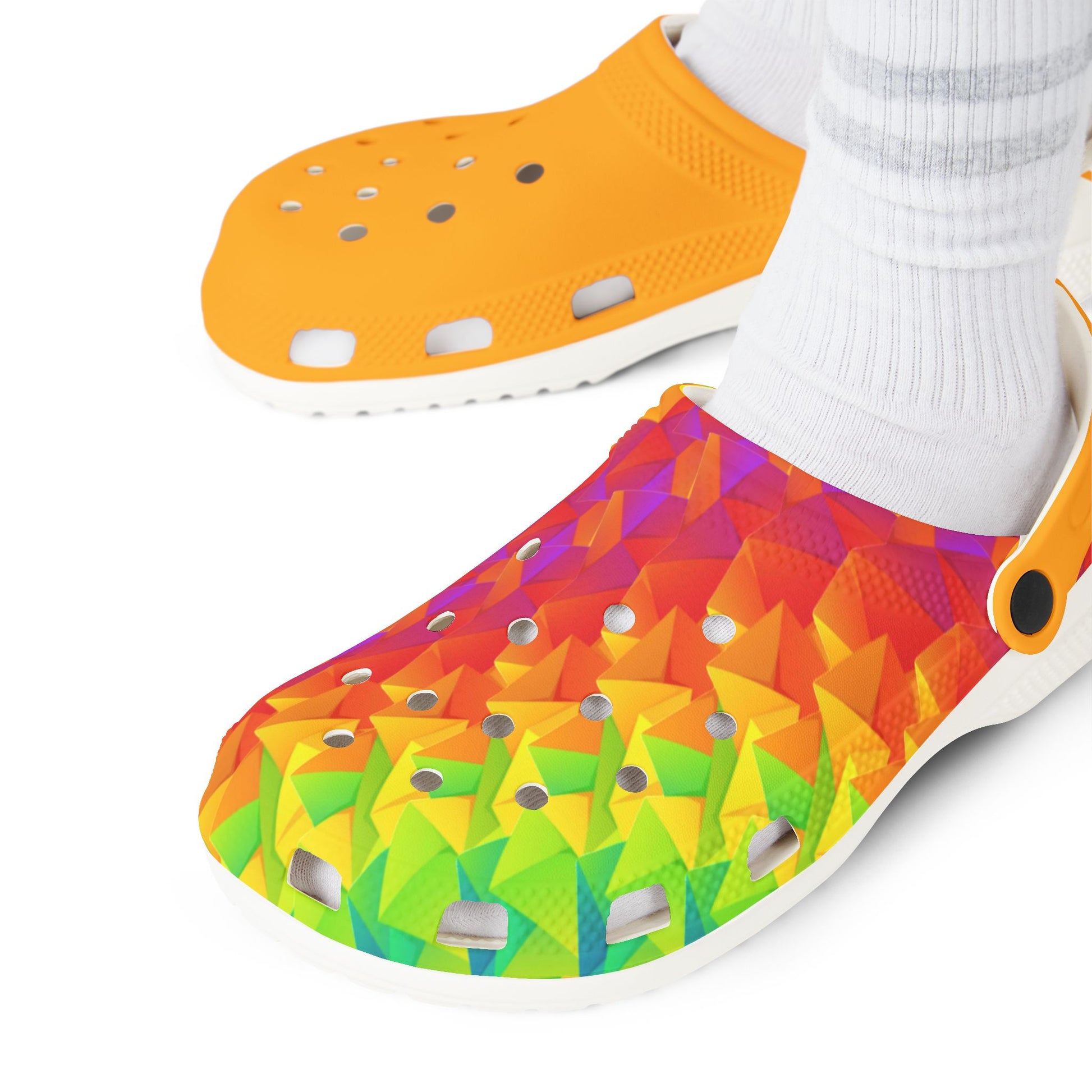 Orange clog shoes and multicolor geometric clog worn with white crew socks