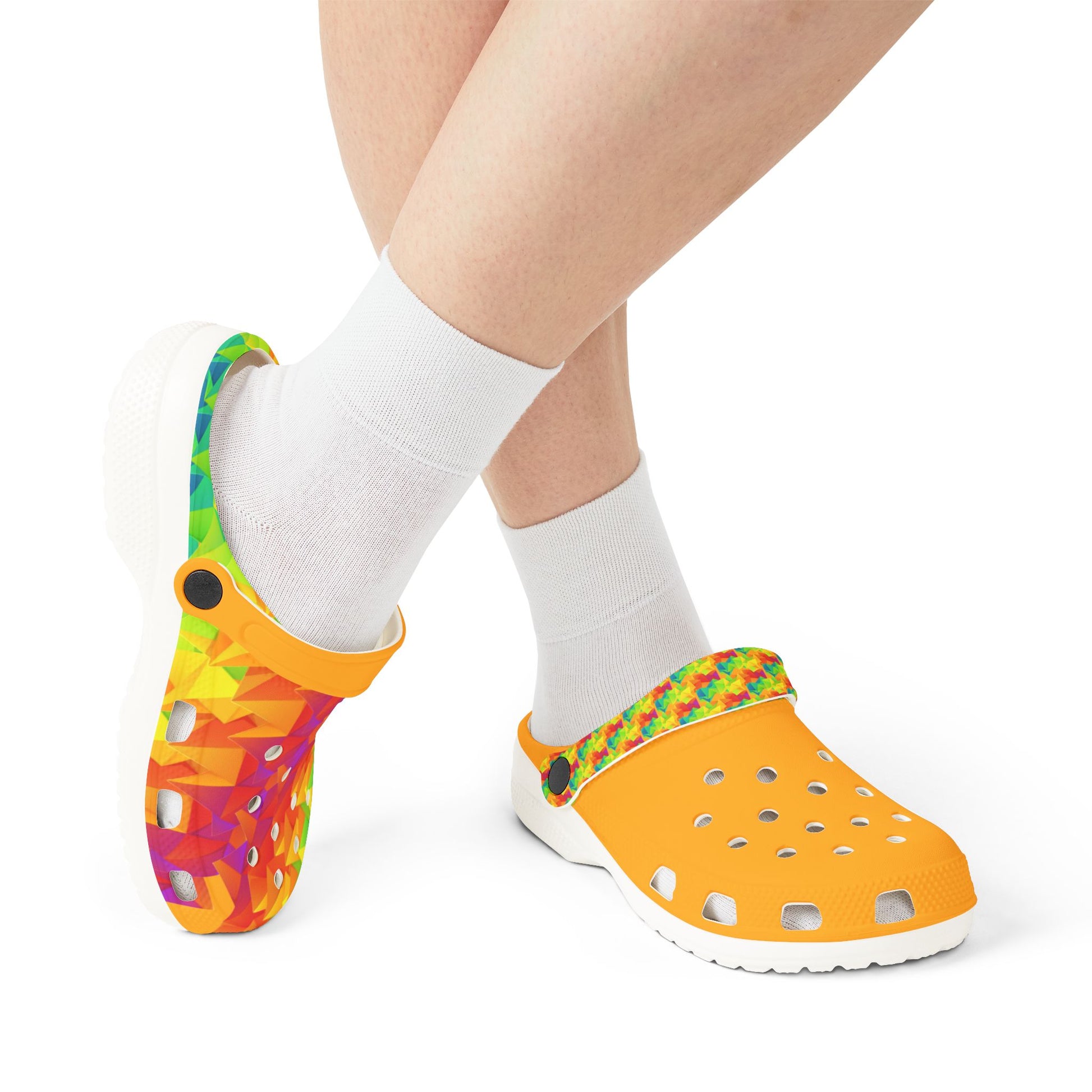 Clog shoes worn with white crew socks, orange upper and multicolor geometric strap