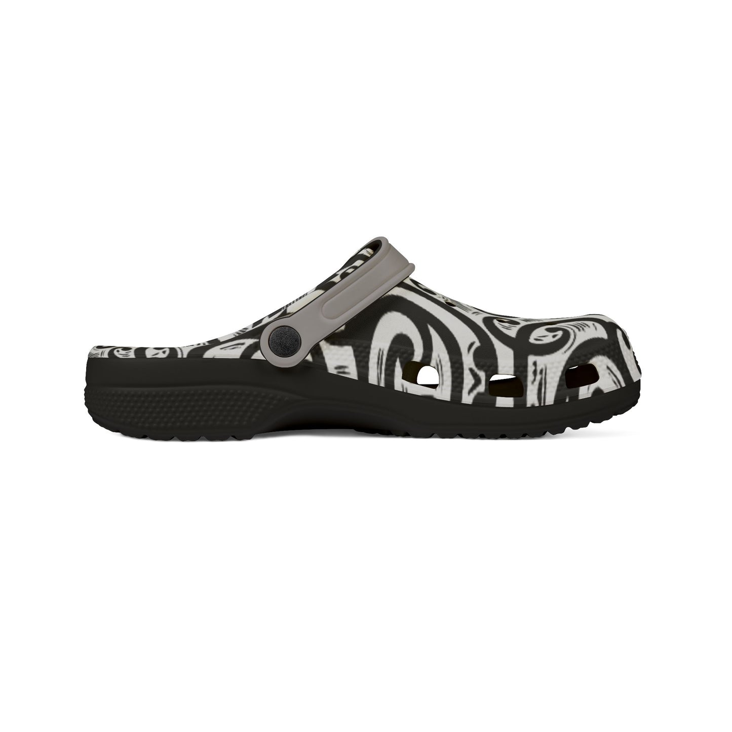 Croc-style clog with black-and-white patterned upper, strap with pin buckle, side view