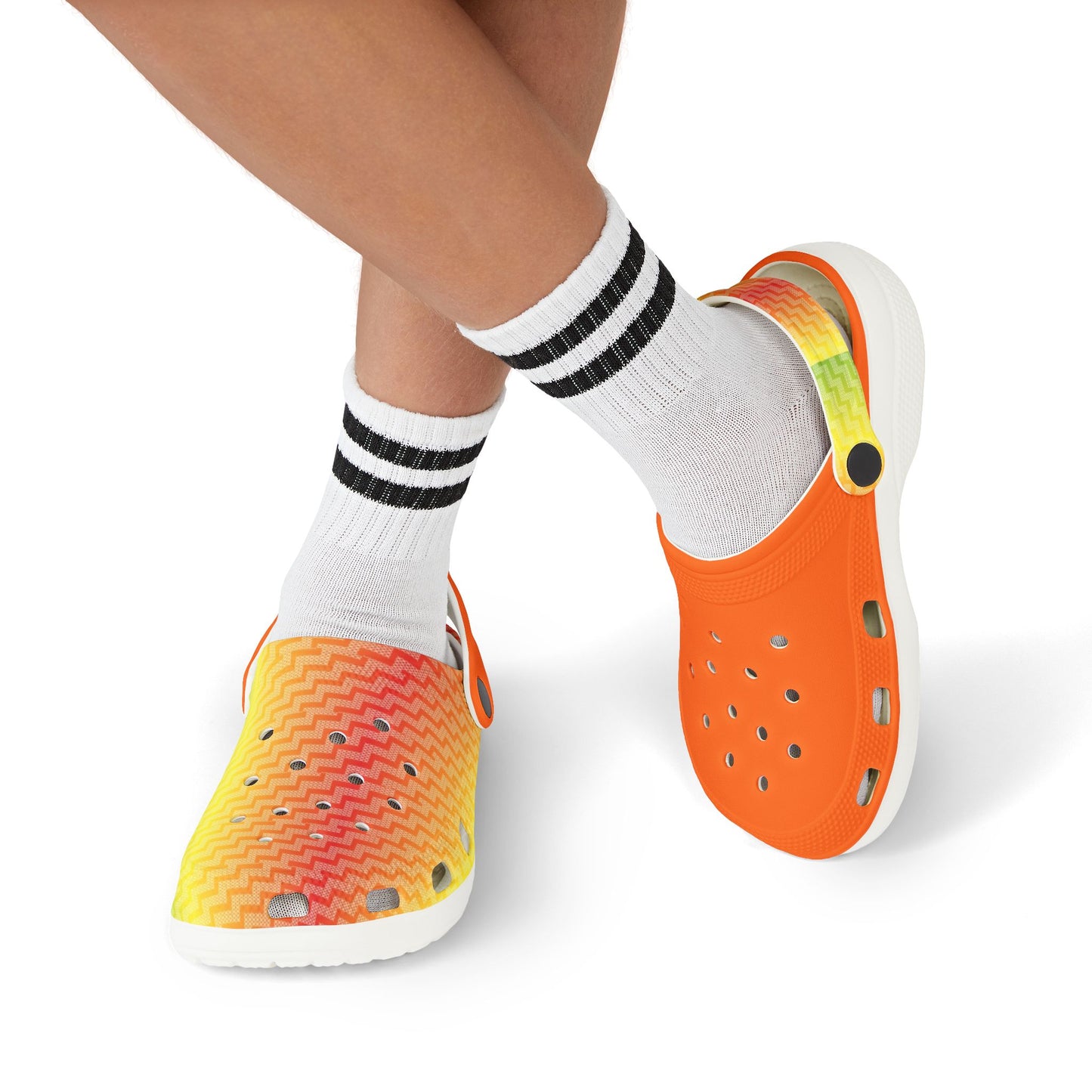 Croc-style clogs being worn with white socks; orange clog and multicolor zigzag clog