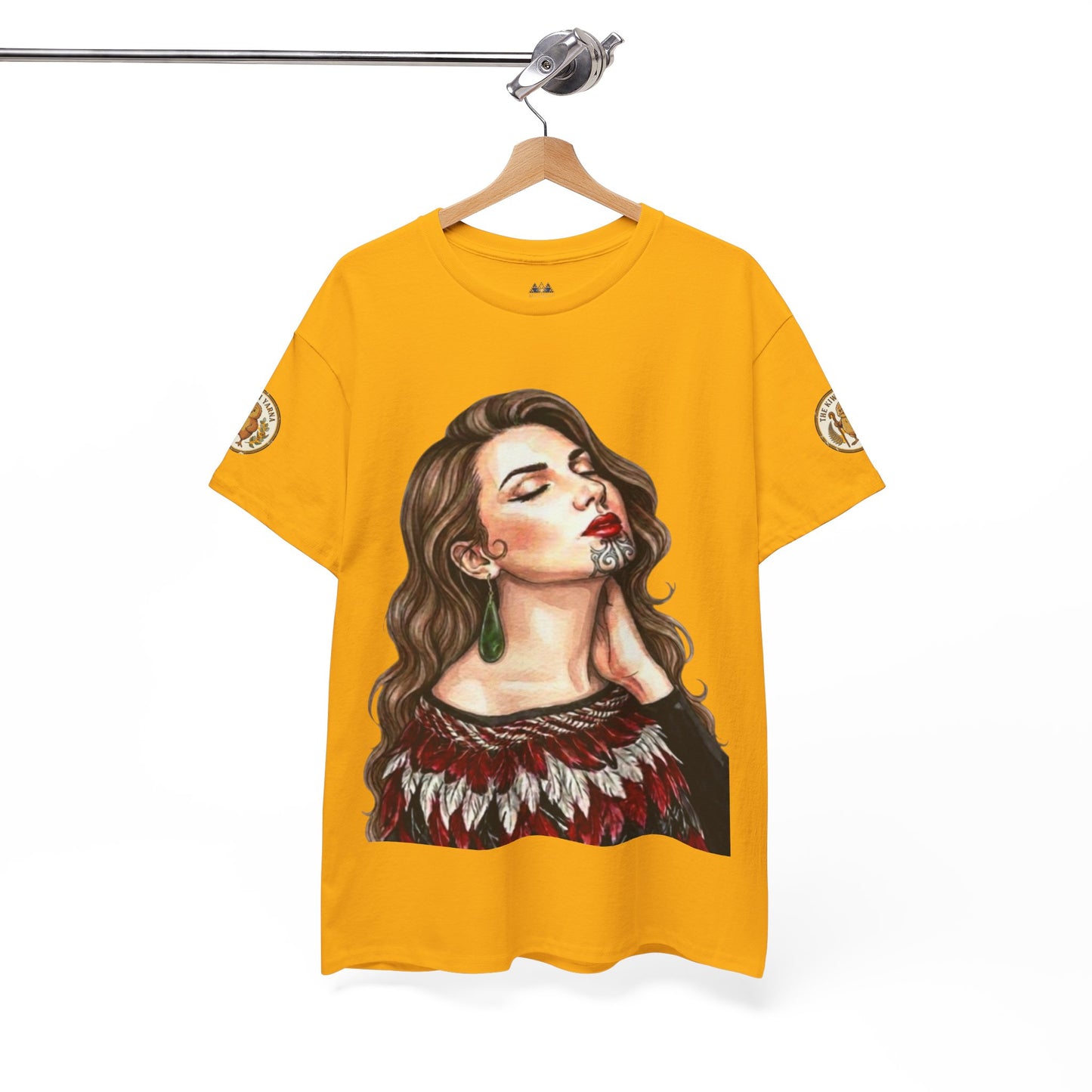 Mustard yellow crew-neck t-shirt on hanger, with portrait graphic and sleeve badges.