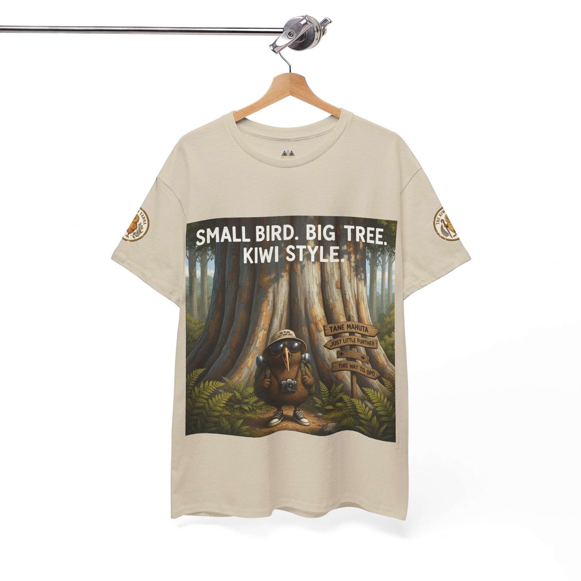 Beige short-sleeve T-shirt on hanger with forest graphic and 'Kiwi Style' text