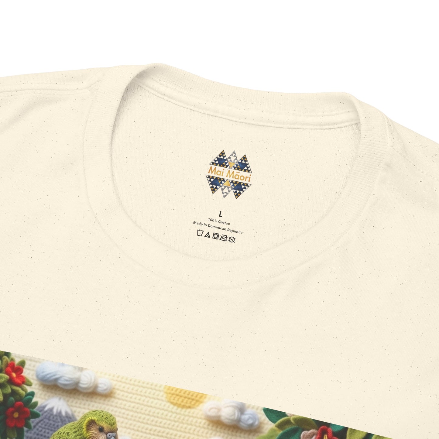 Close-up of off-white t-shirt neckline with small chest logo and bird graphic edge