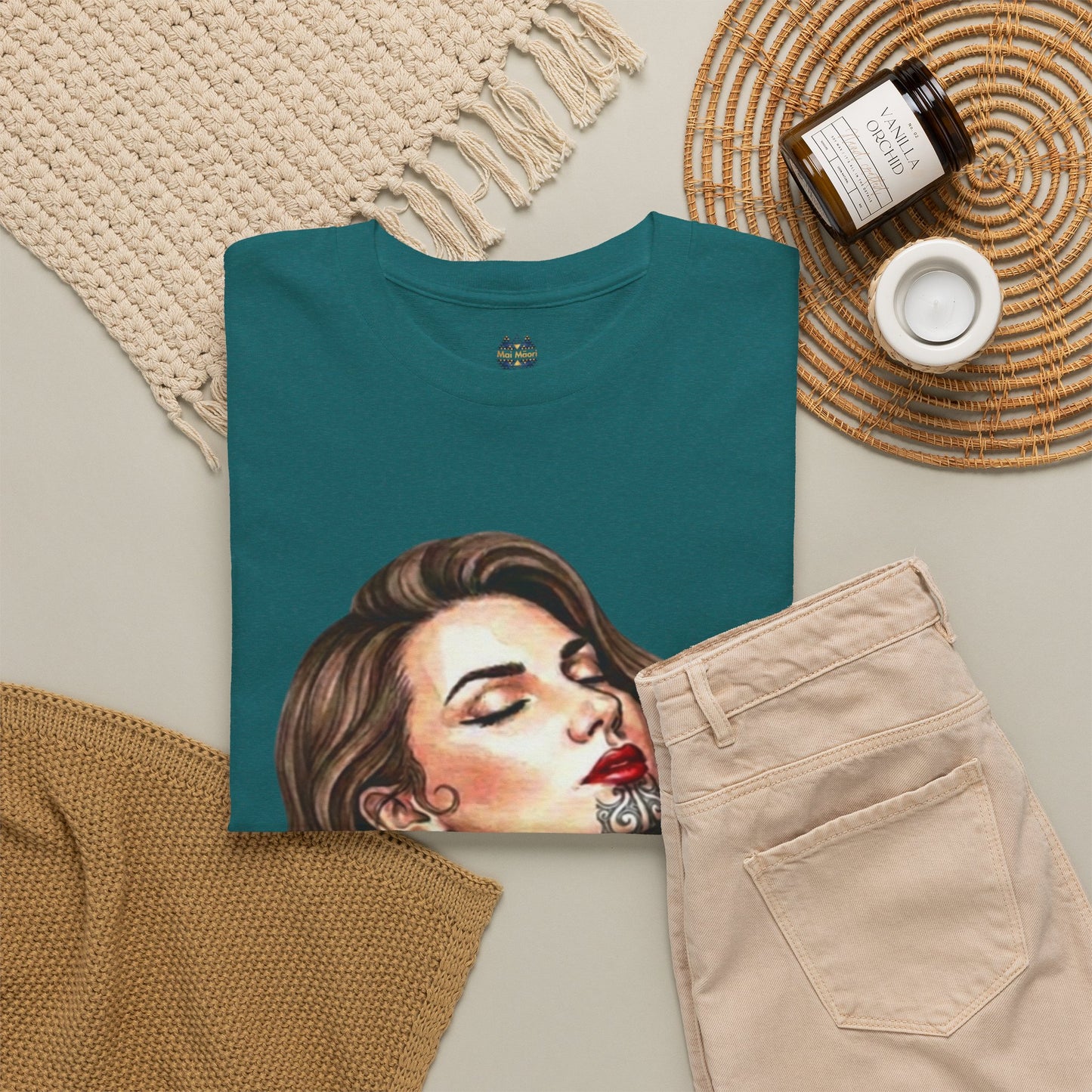 Teal crew-neck graphic T-shirt with close woman portrait print and small chest logo