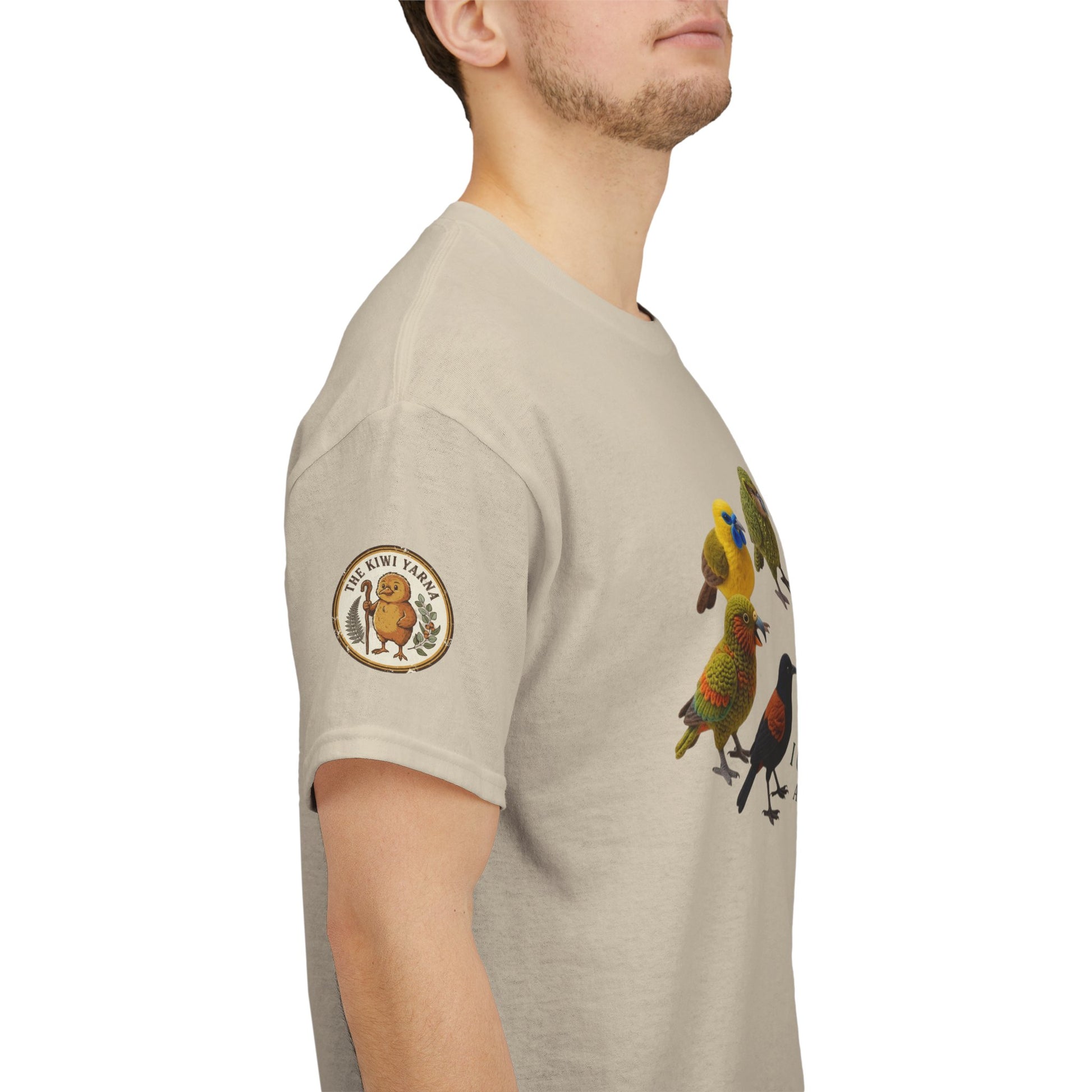 Natural T-shirt with side sleeve graphic patch and colorful birds artwork.