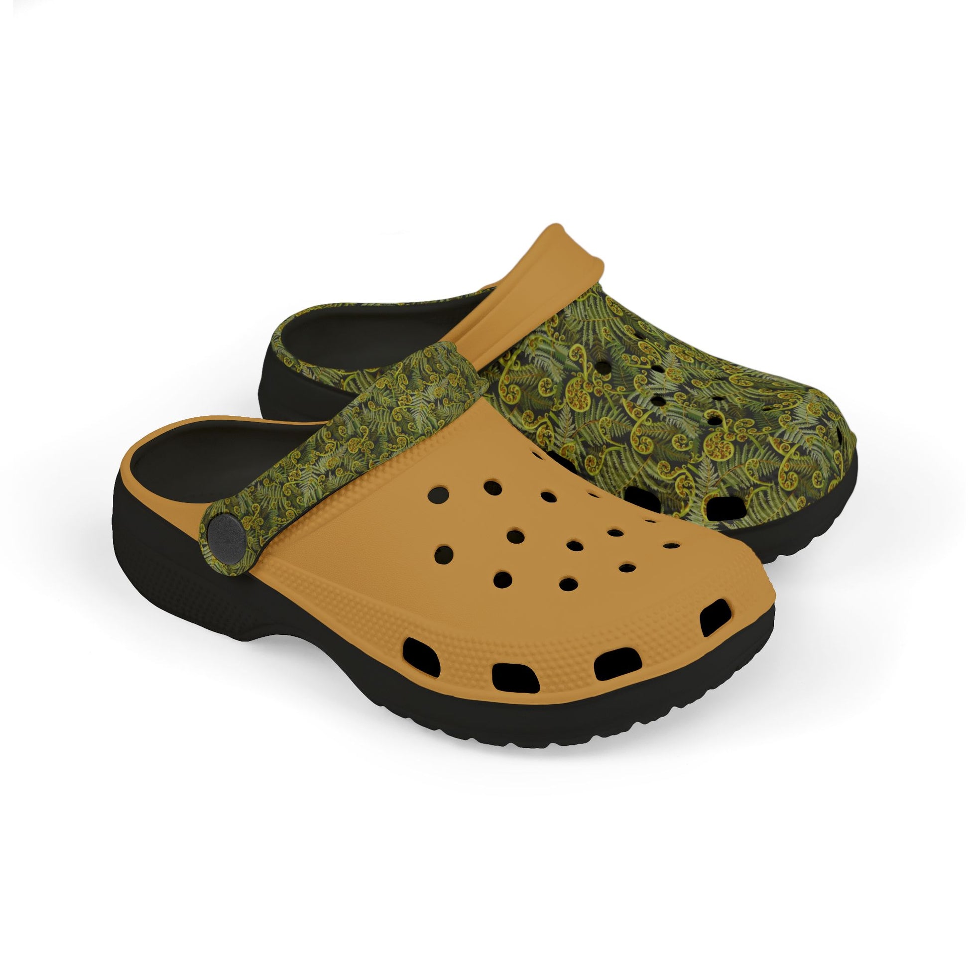 Slip-on clogs with green patterned upper, tan perforated forefoot, and black outsole