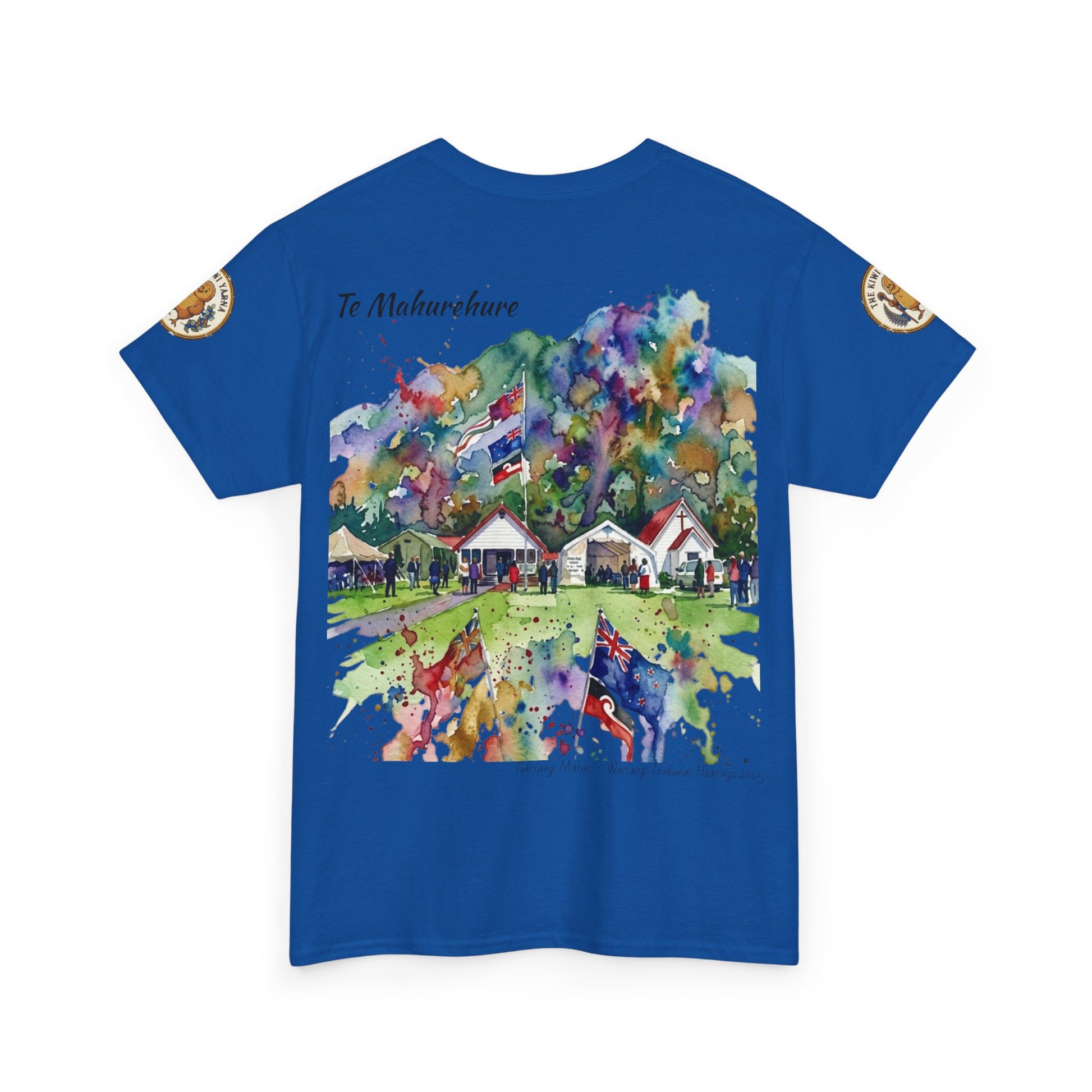 Blue graphic T-shirt with colorful landscape print and sleeve emblem patches