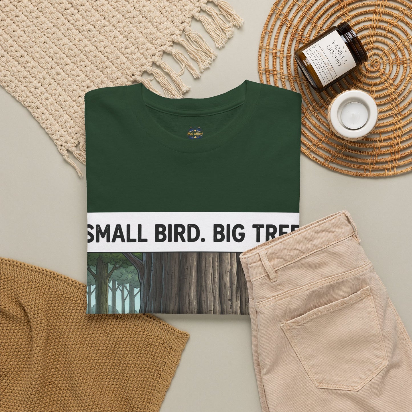 Dark green crewneck graphic T-shirt with “SMALL BIRD. BIG TREE.” and forest print