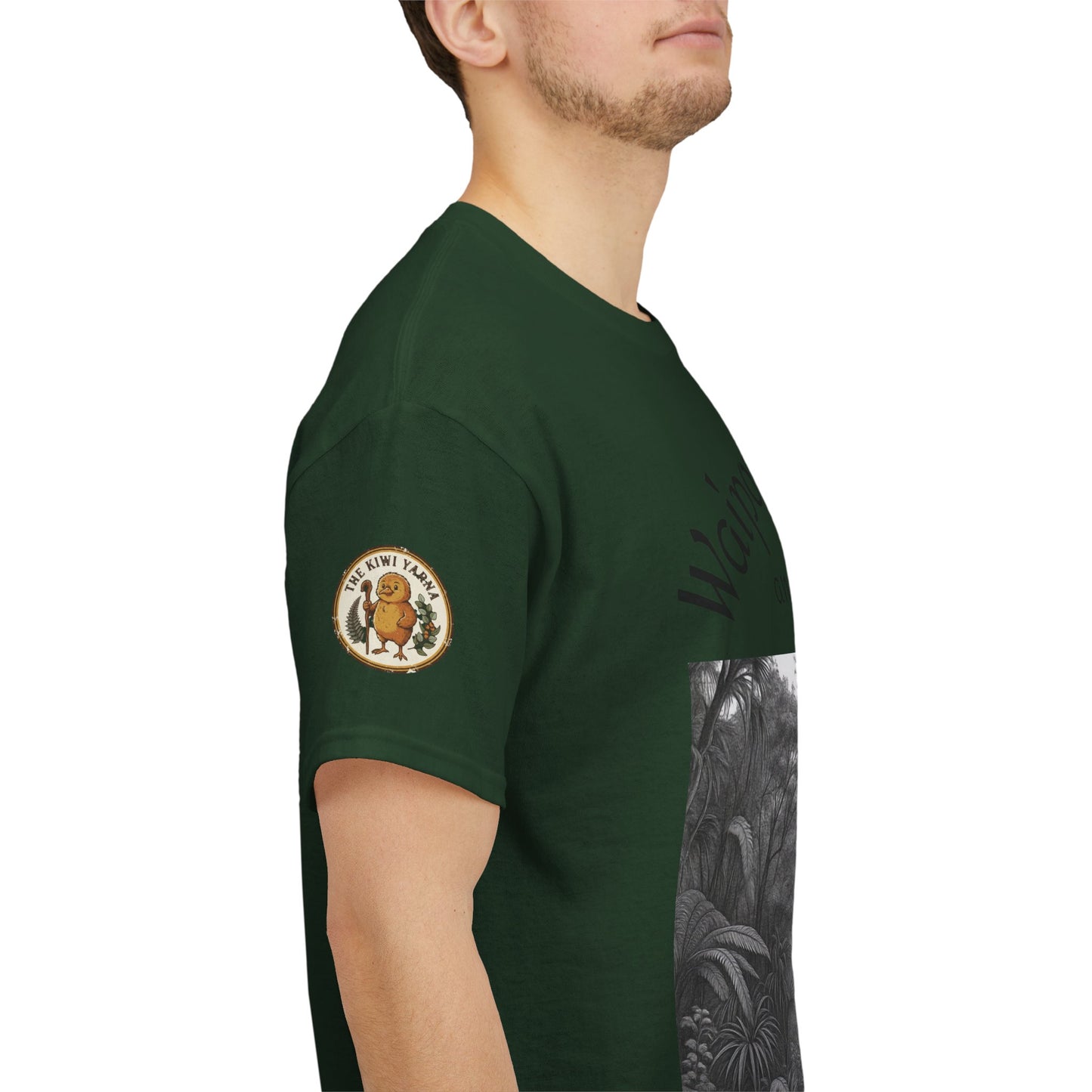 Forest green T-shirt with round sleeve badge and partial black-and-white graphic