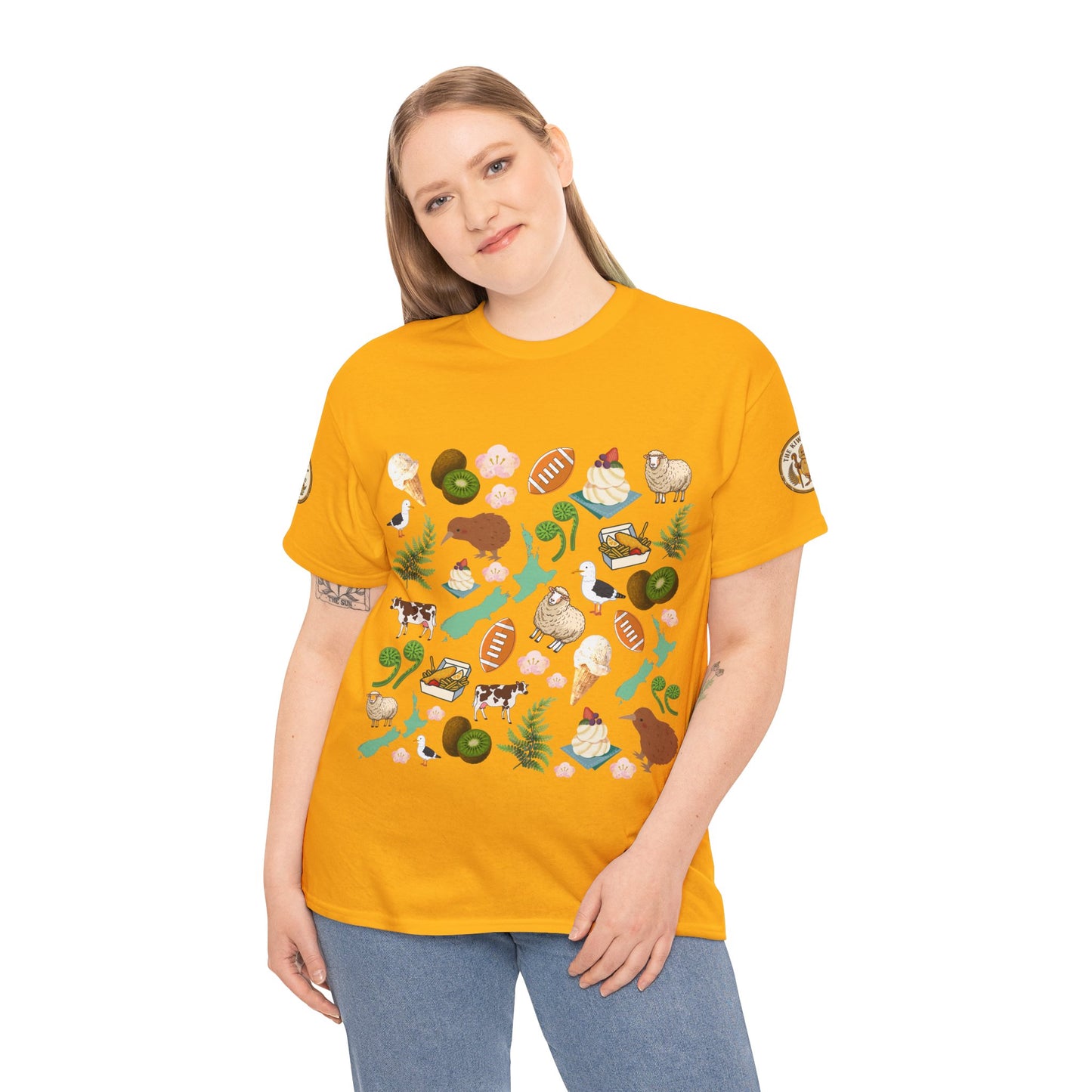 Mustard yellow Kiwiana-style graphic T-shirt worn by a model; round neck and short sleeves