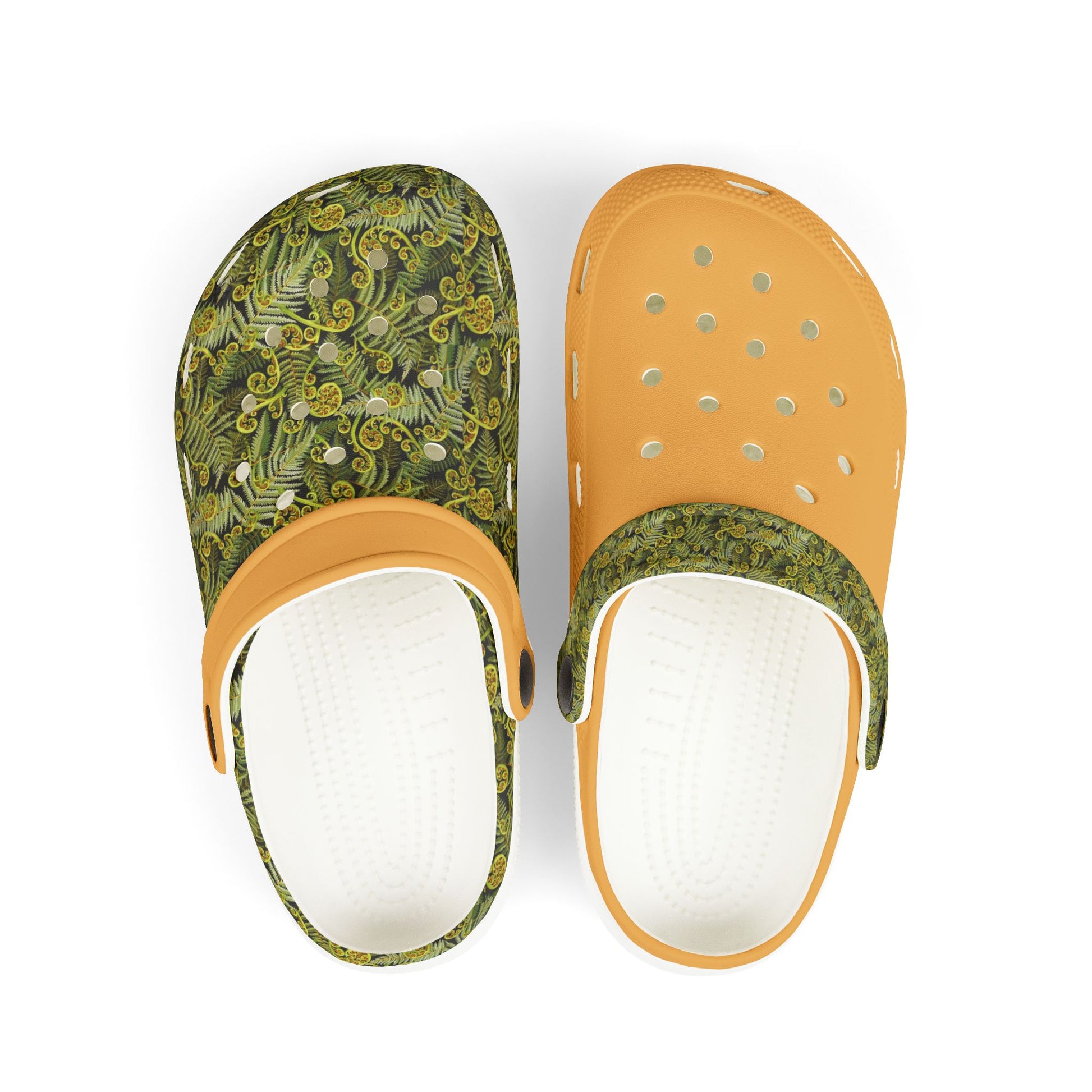 Pair of patterned clogs with tan perforated top and white insoles
