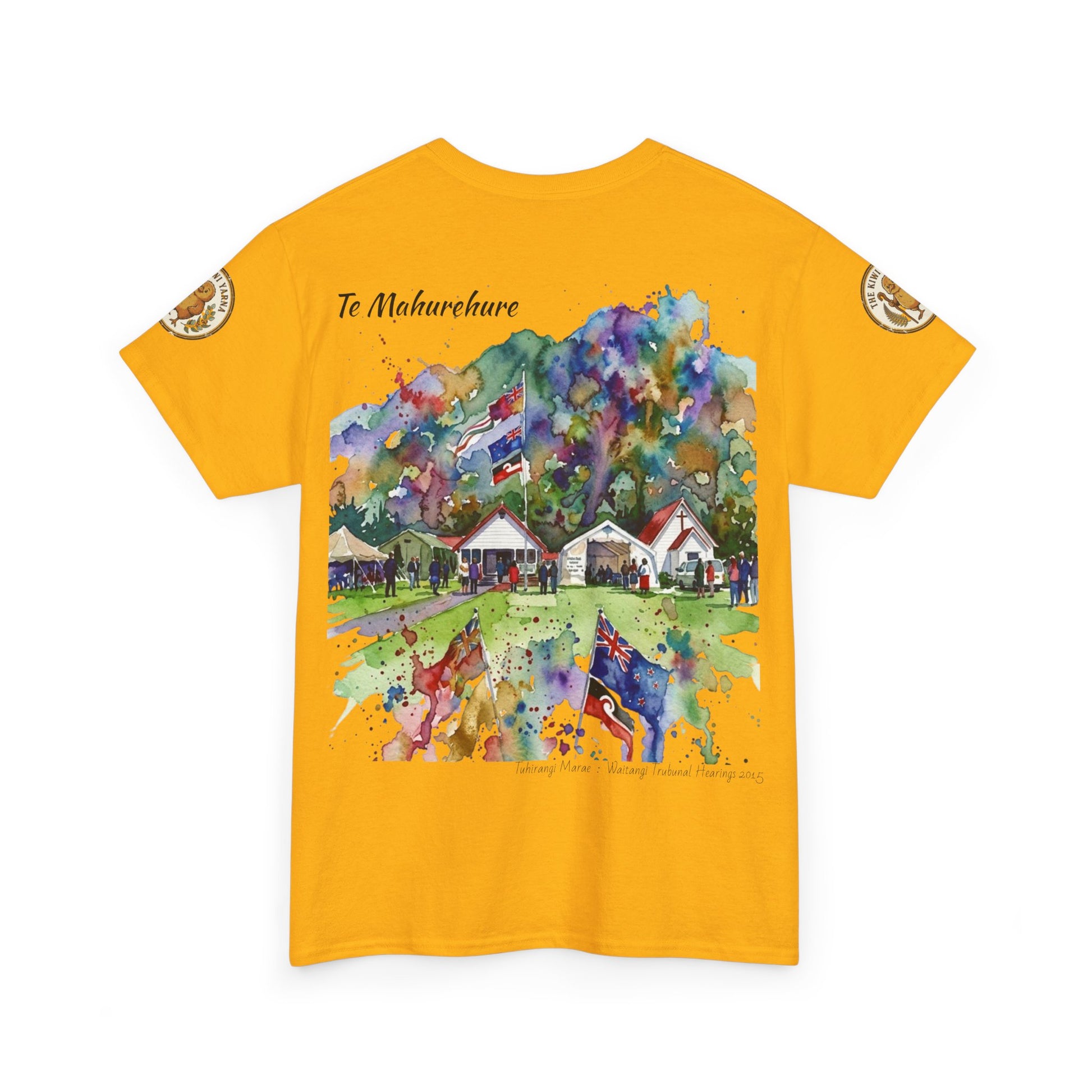 Yellow T-shirt with village watercolor scene and “Te Mahurehure” text