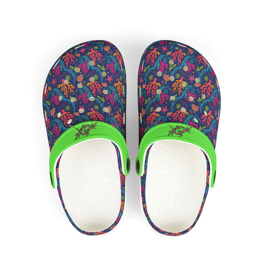 Two patterned clogs showing white interior with green strap on blue/purple upper.