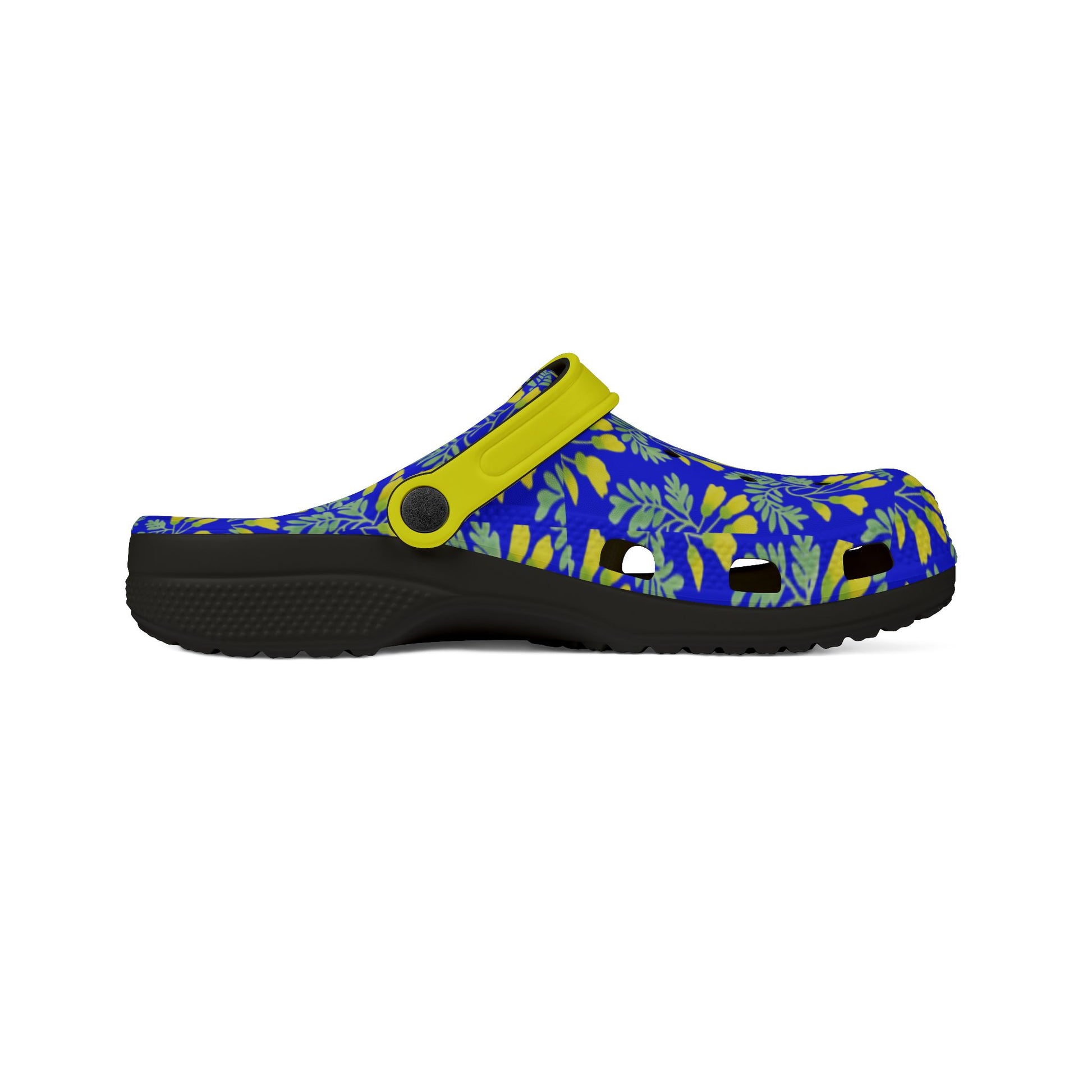 Kōwhai slip-on clogs with blue leaf print upper, yellow strap, black outsole