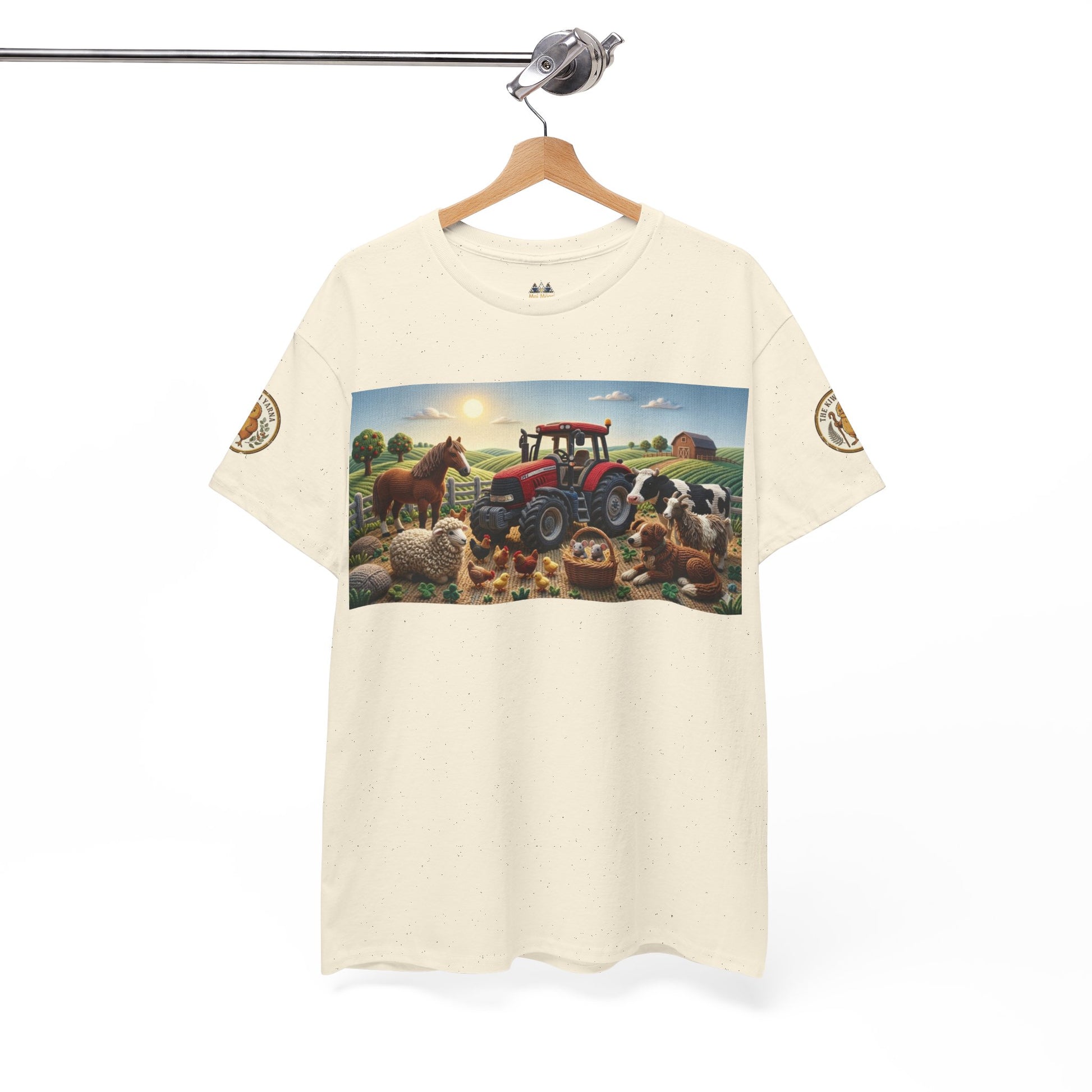 Cream graphic T-shirt hanging on a hanger, front farm scene rectangle print