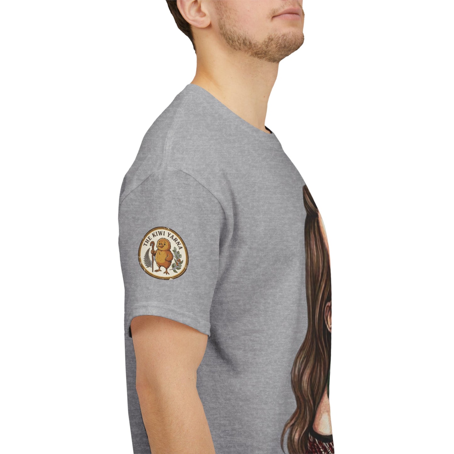 Gray crew-neck t-shirt, side view, with sleeve badge and partial portrait print.
