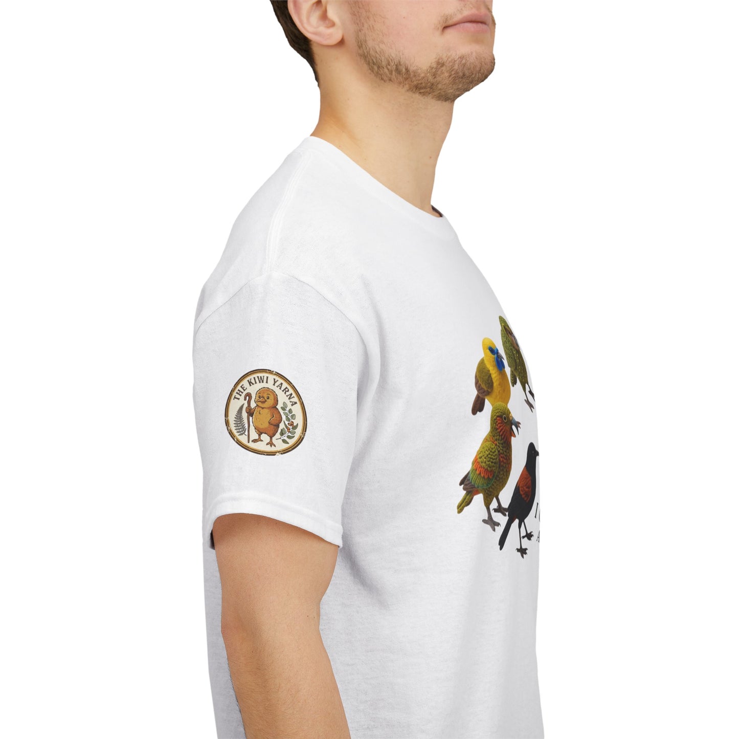 White T-shirt with colorful bird graphic and circular logo patch on sleeve.