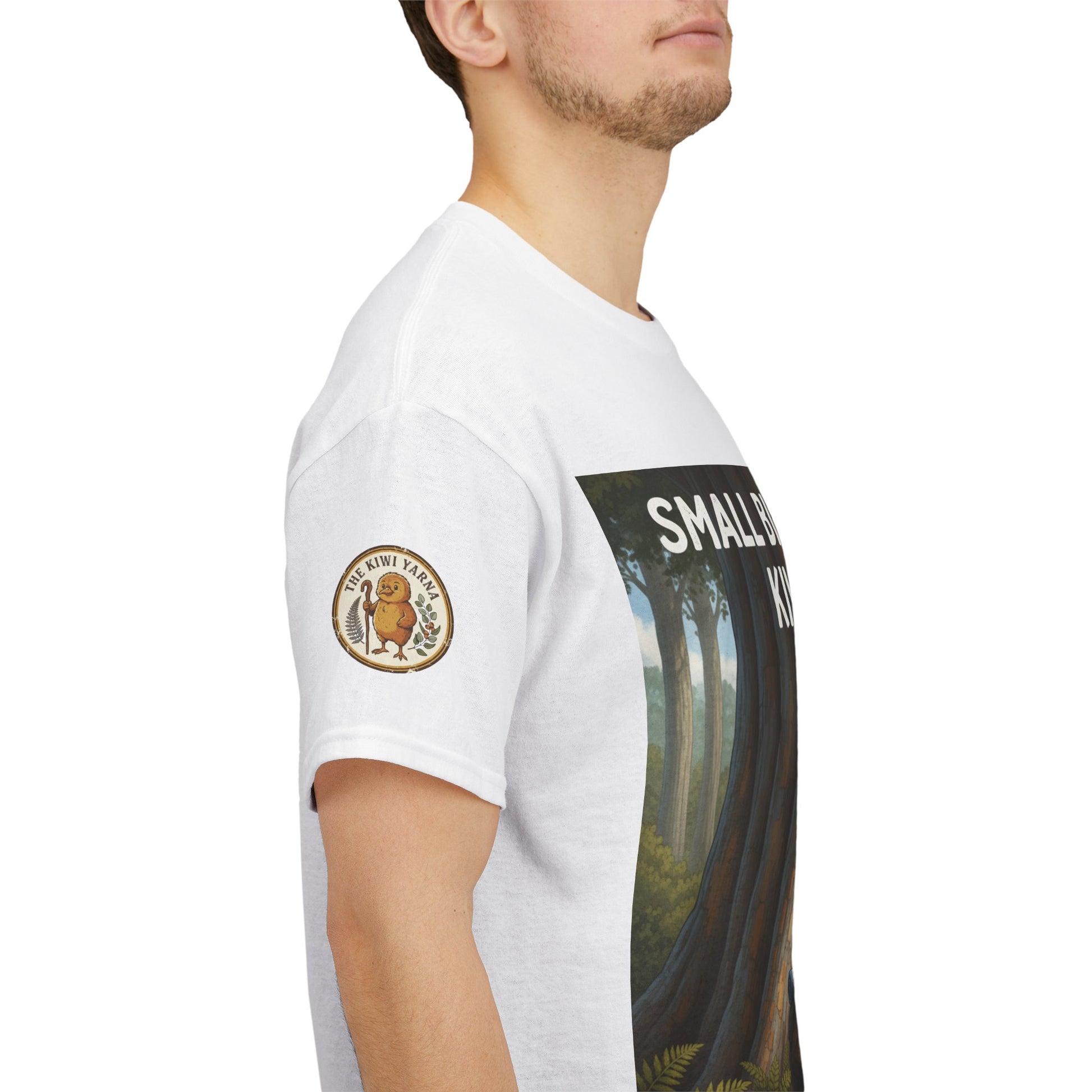 White graphic T-shirt with side tree scene print and circular chest logo patch
