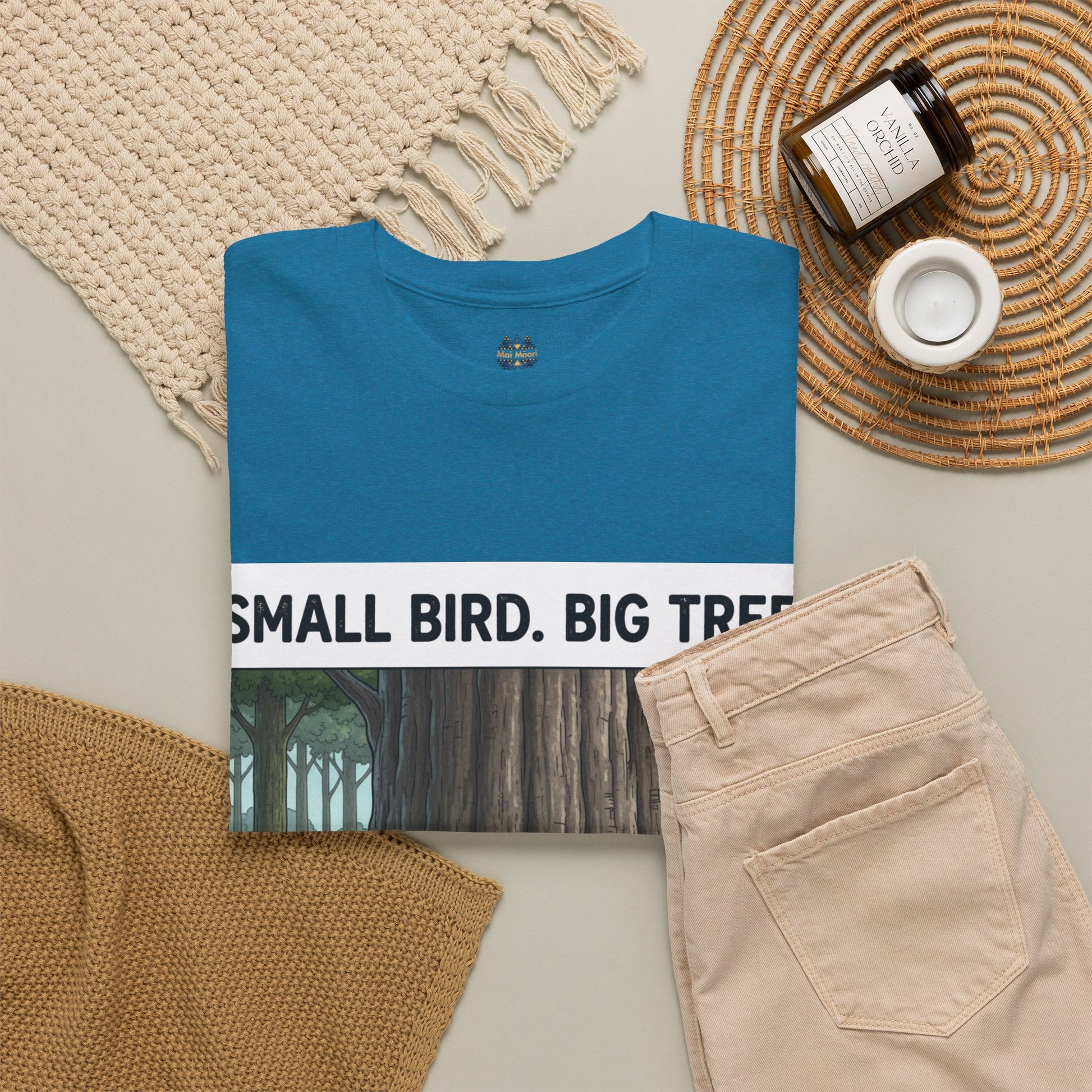Teal T-shirt with partial front text "SMALL BIRD. BIG TR" and crew neck