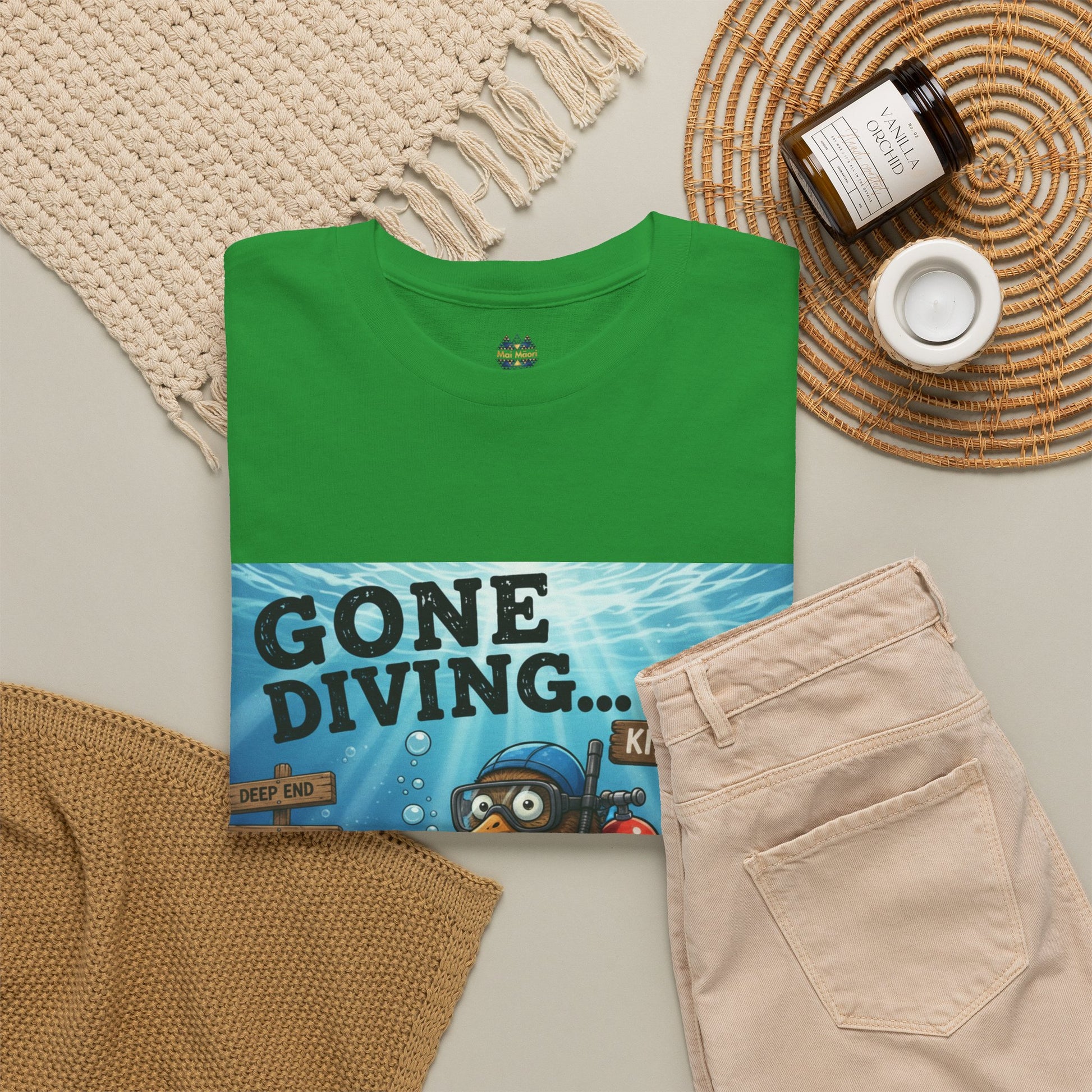 Green T-shirt with ocean diver graphic print; small chest logo