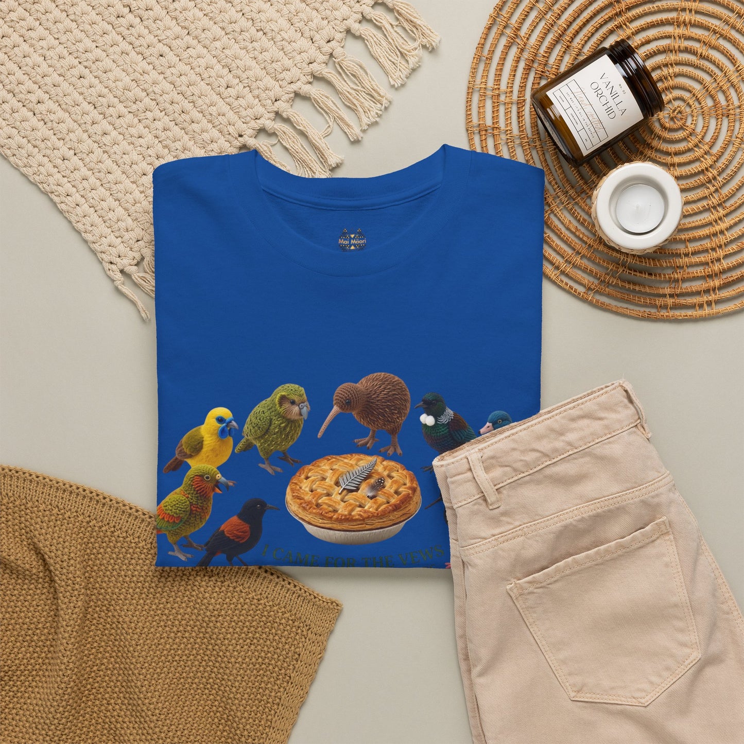 Blue graphic T-shirt with birds and pizza illustration across the front