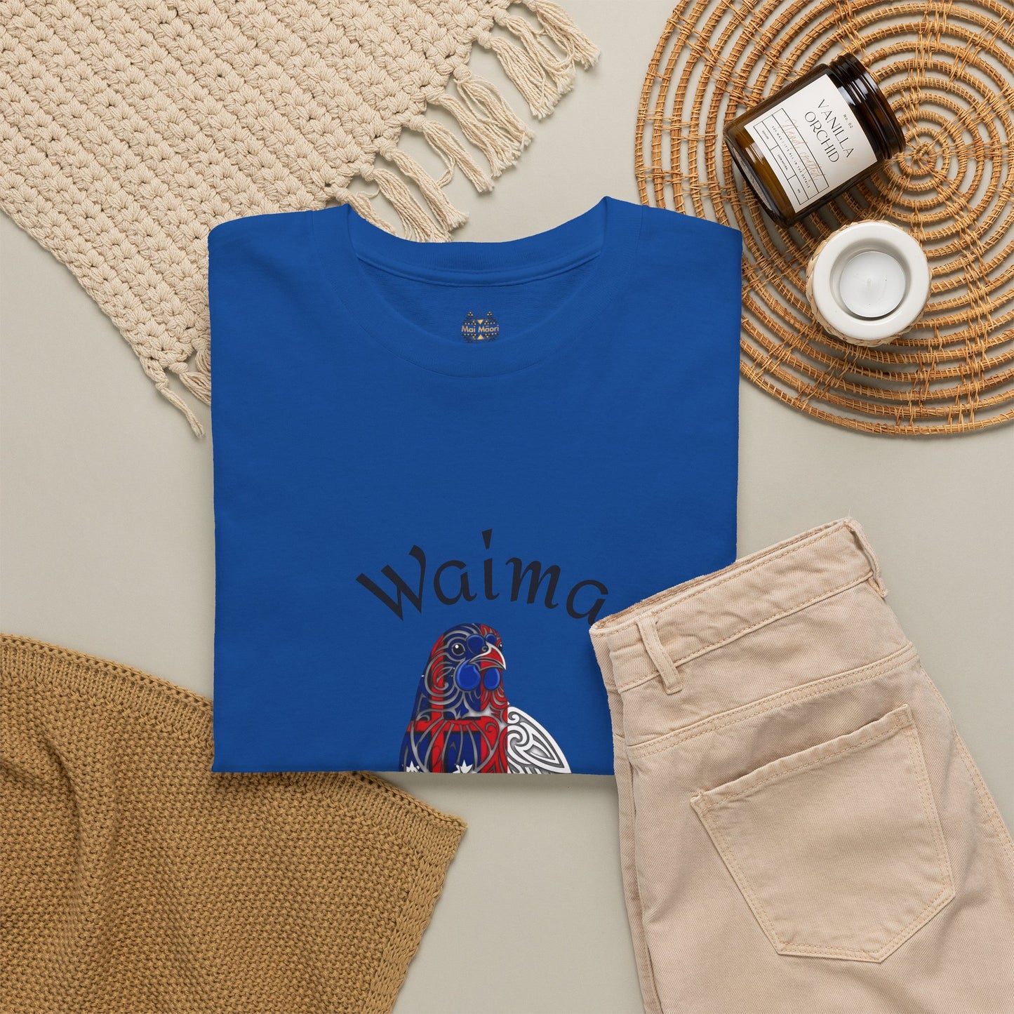 Blue T-shirt with Waima Hokianga bird graphic and small round chest logo