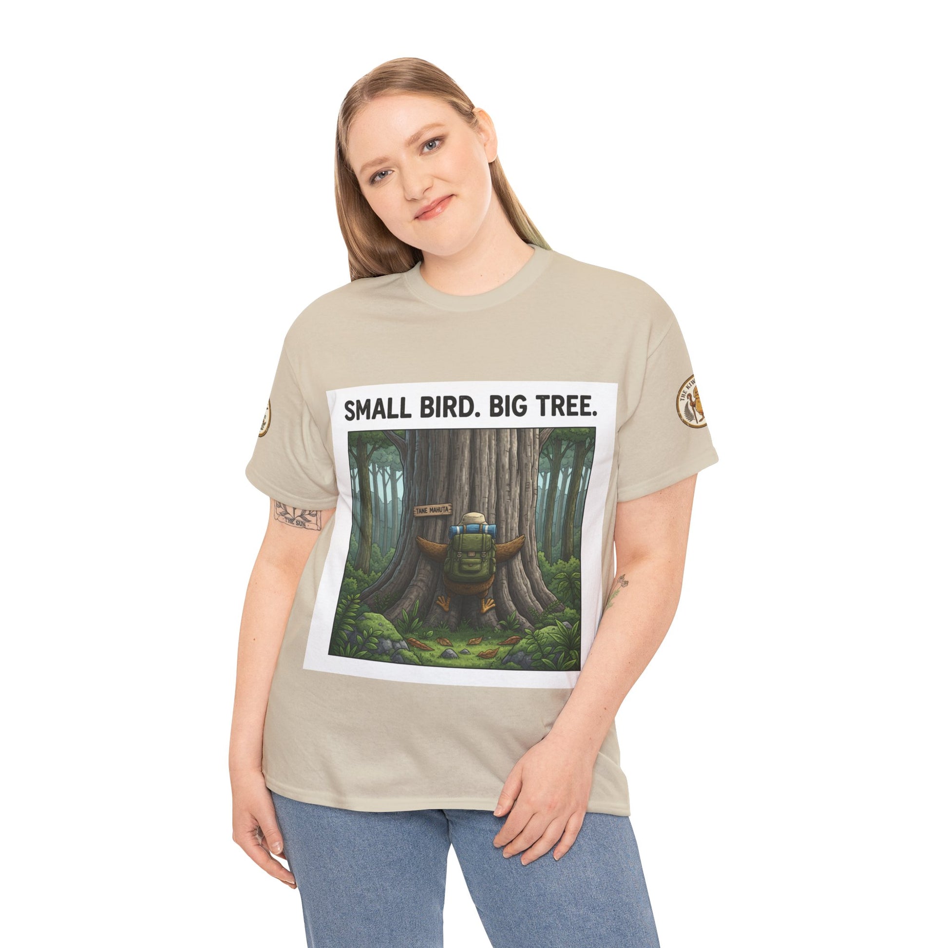 Beige T-shirt on model with front 'SMALL BIRD. BIG TREE.' forest print