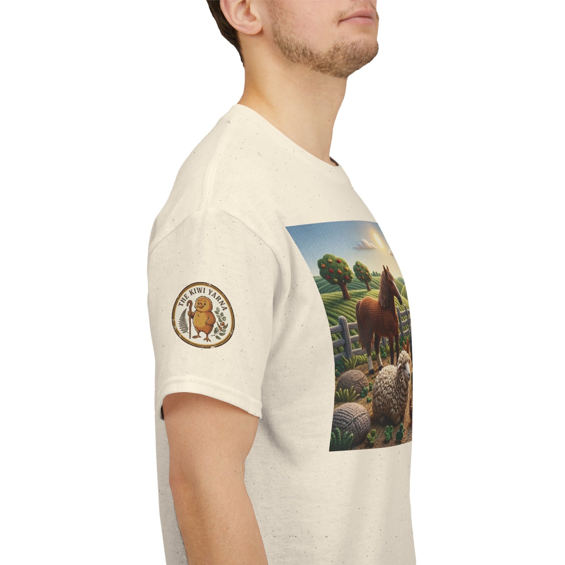 Cream T-shirt with farm animals graphic and round logo patch on left sleeve.