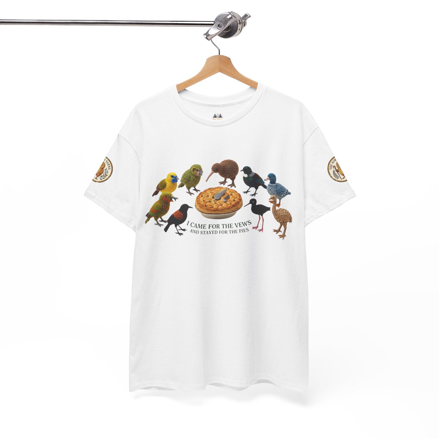 White T-shirt on hanger with birds and pie graphic, short sleeves with patch details.