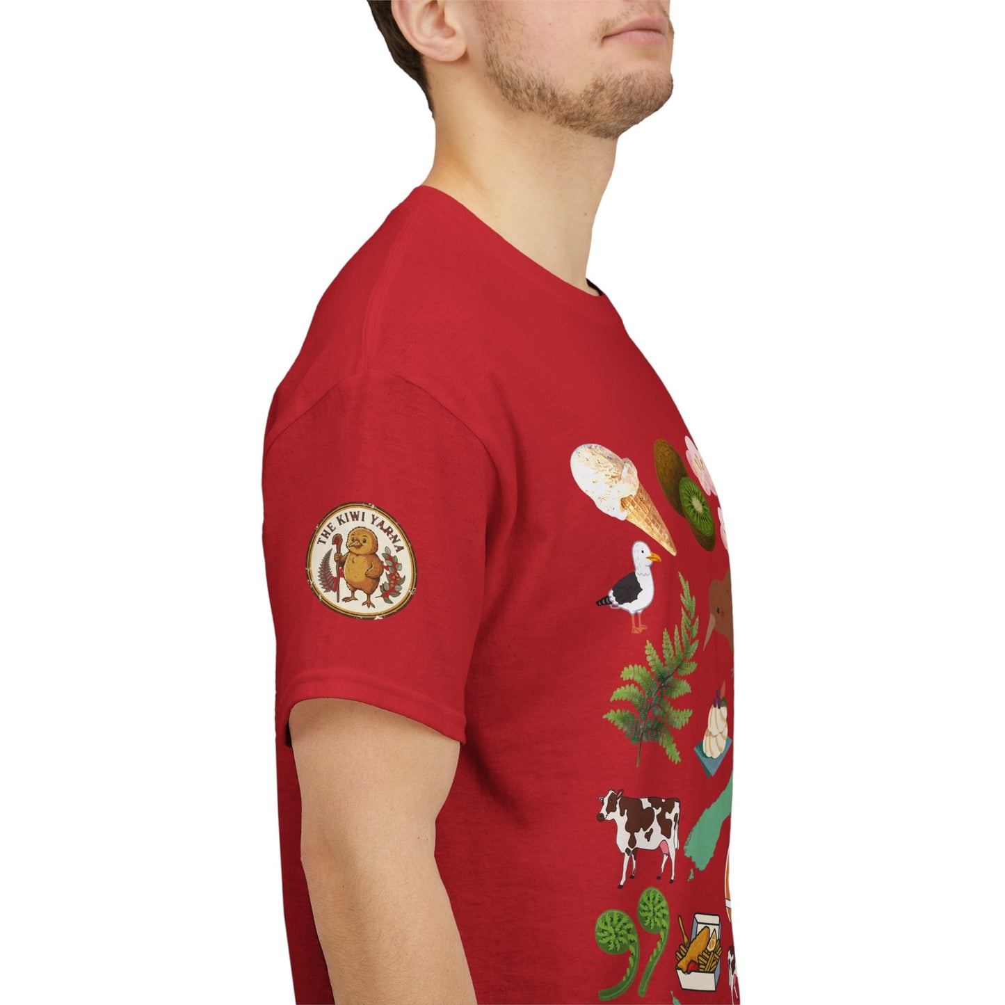 Red Kiwiana T-shirt with illustrated sleeve badges and bird, animal, plant motifs