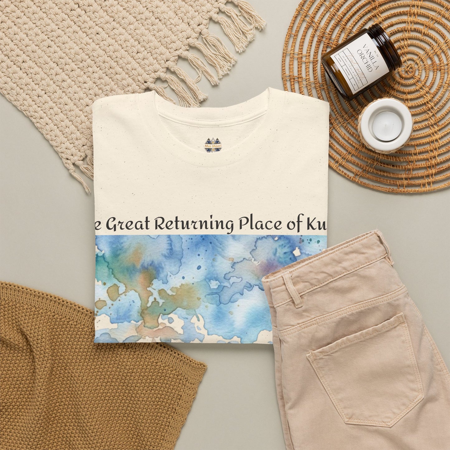 Cream T-shirt with partial front landscape print and small chest emblem
