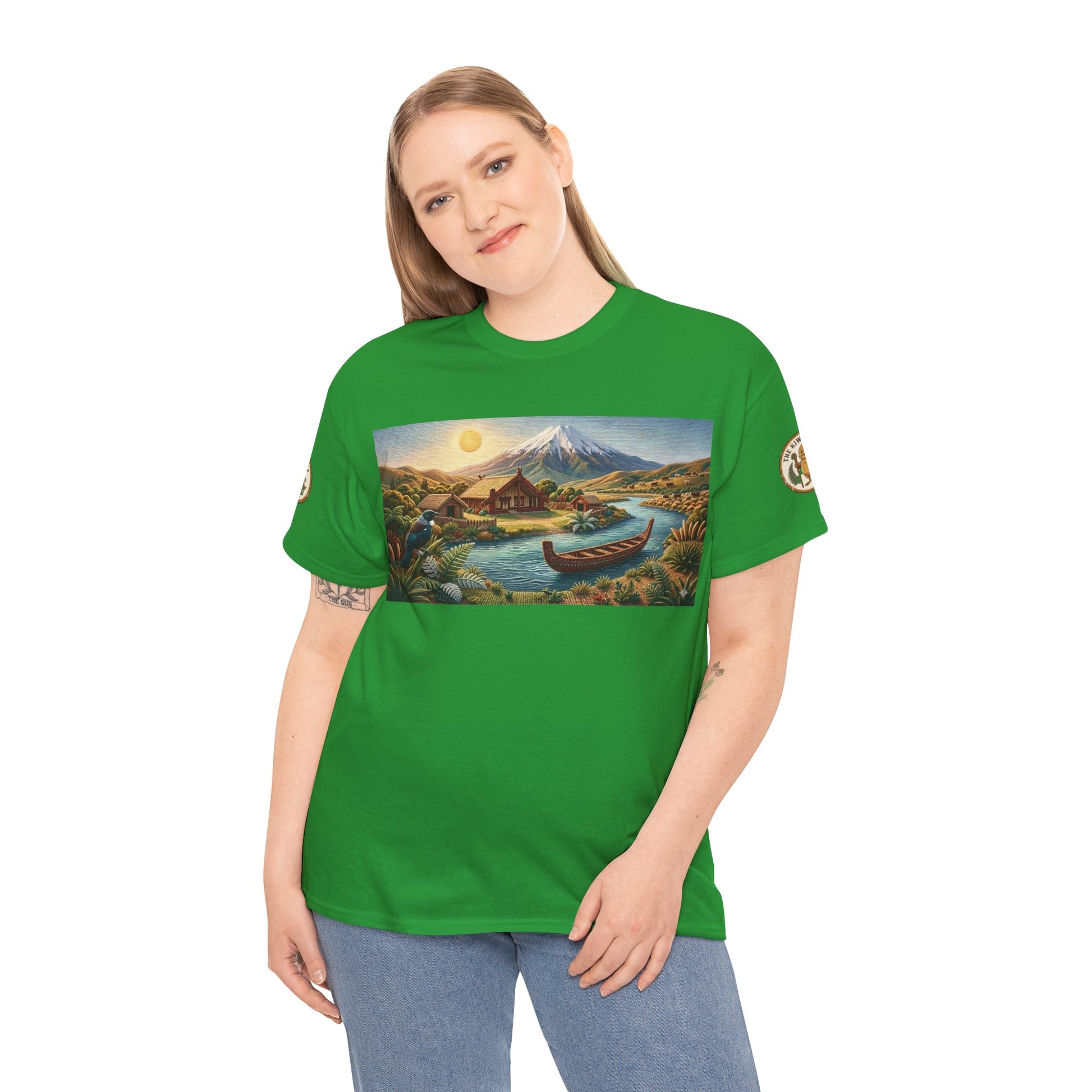 Green crewneck T-shirt worn by a model, with a large landscape graphic and canoe.