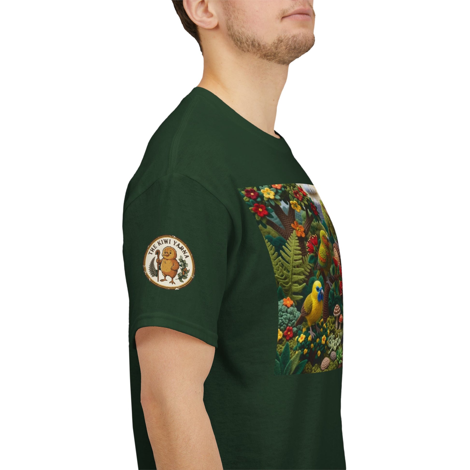 Green T-shirt side view with bird scene panel and circular sleeve patch