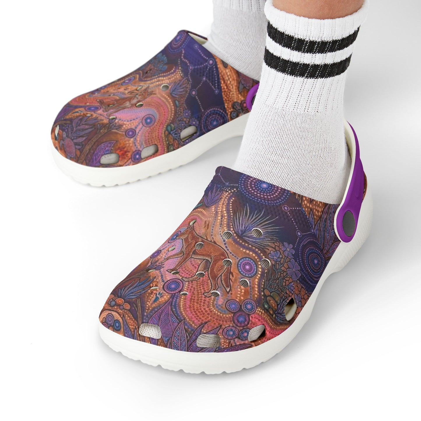 Patterned clog shoes on feet with white crew socks and purple heel strap