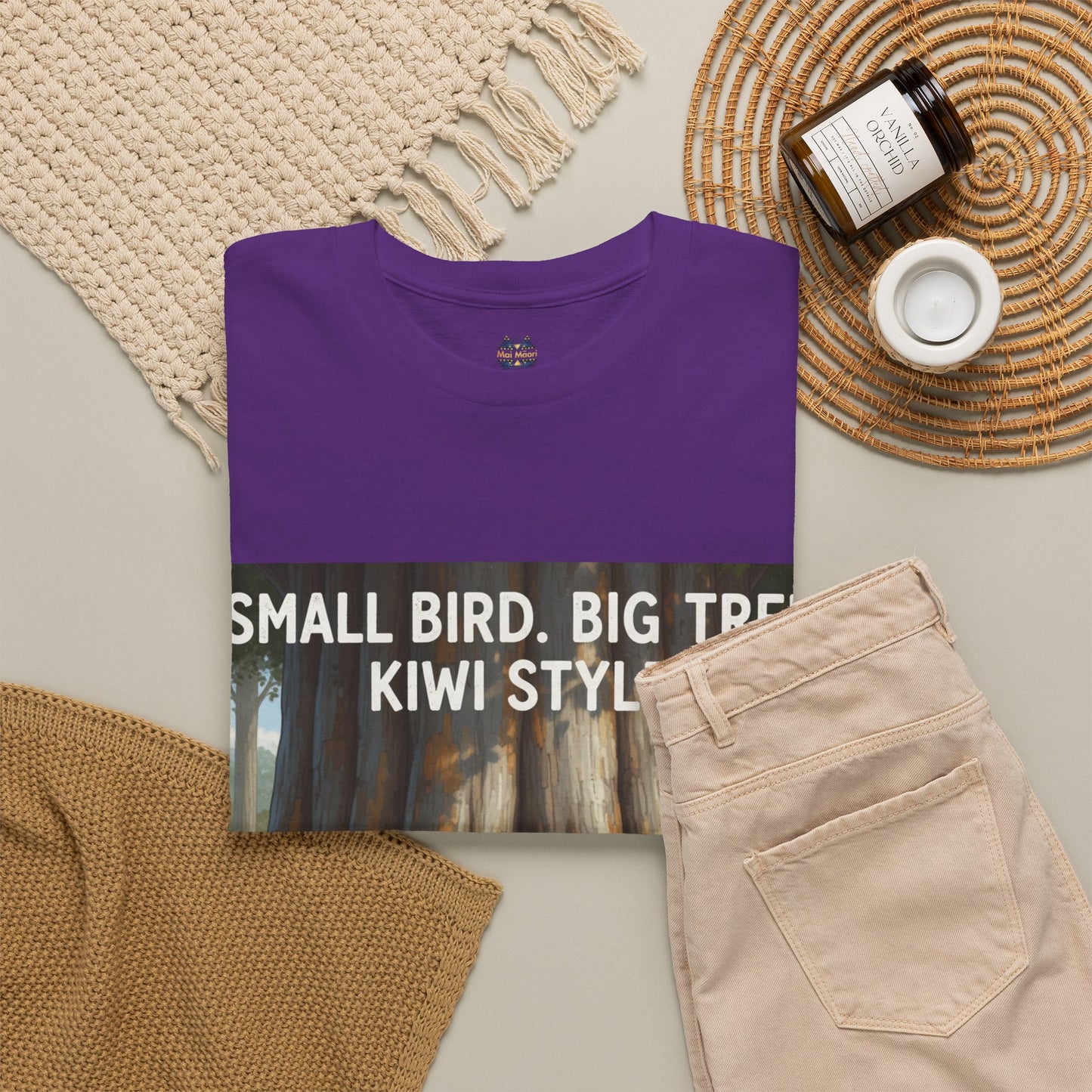 Purple crew-neck T-shirt in flat lay with front print text and illustrated forest scene.