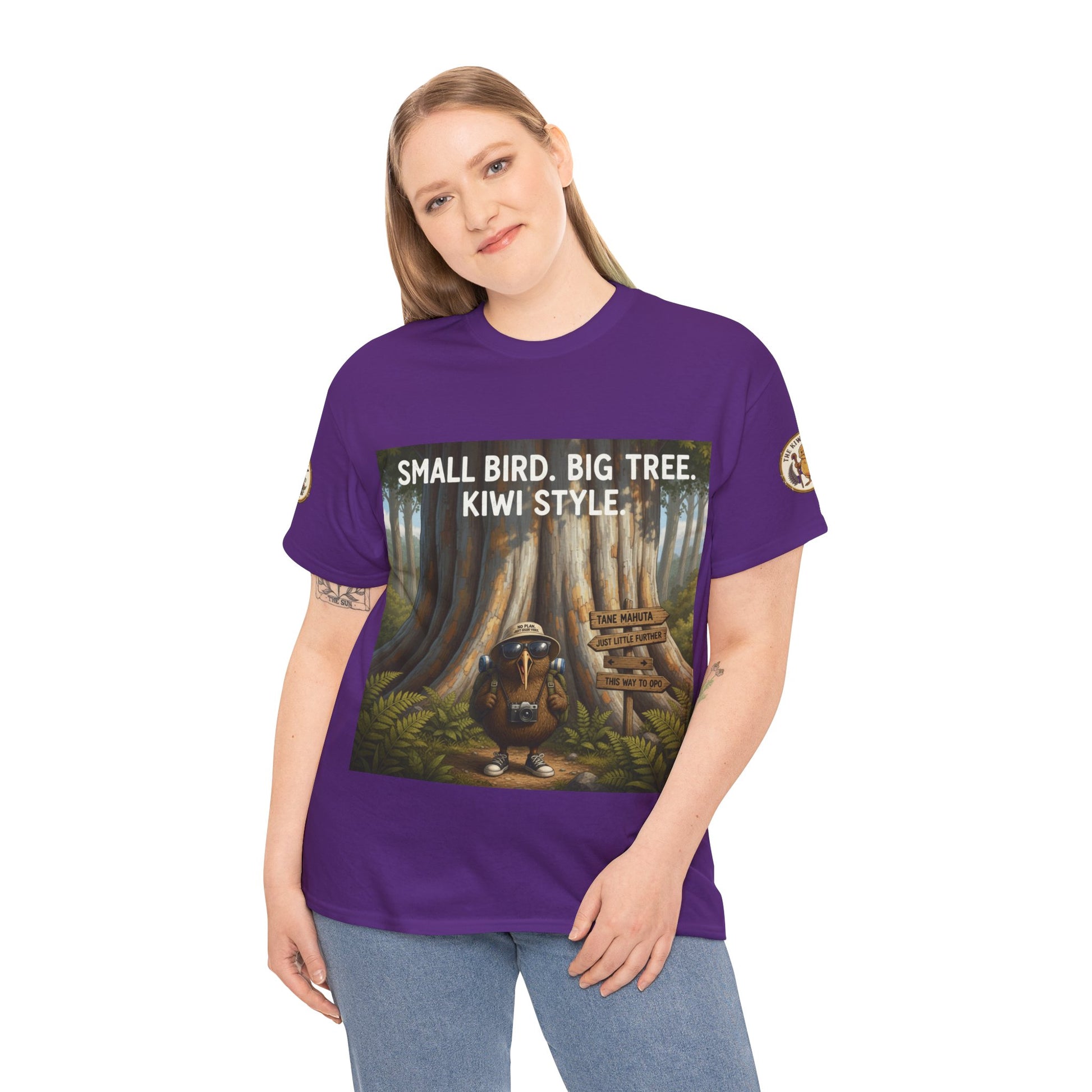 Purple graphic t-shirt on model with tree and kiwi-style front print
