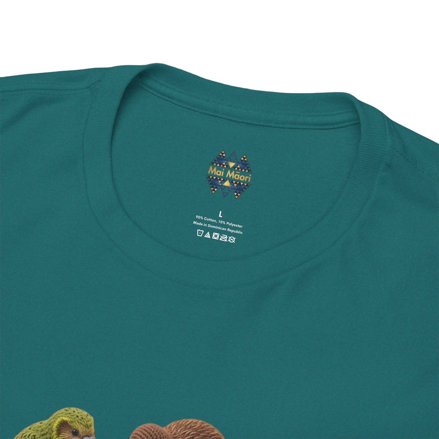 Teal T-shirt close-up: crew neck label above colorful bird and pizza graphic