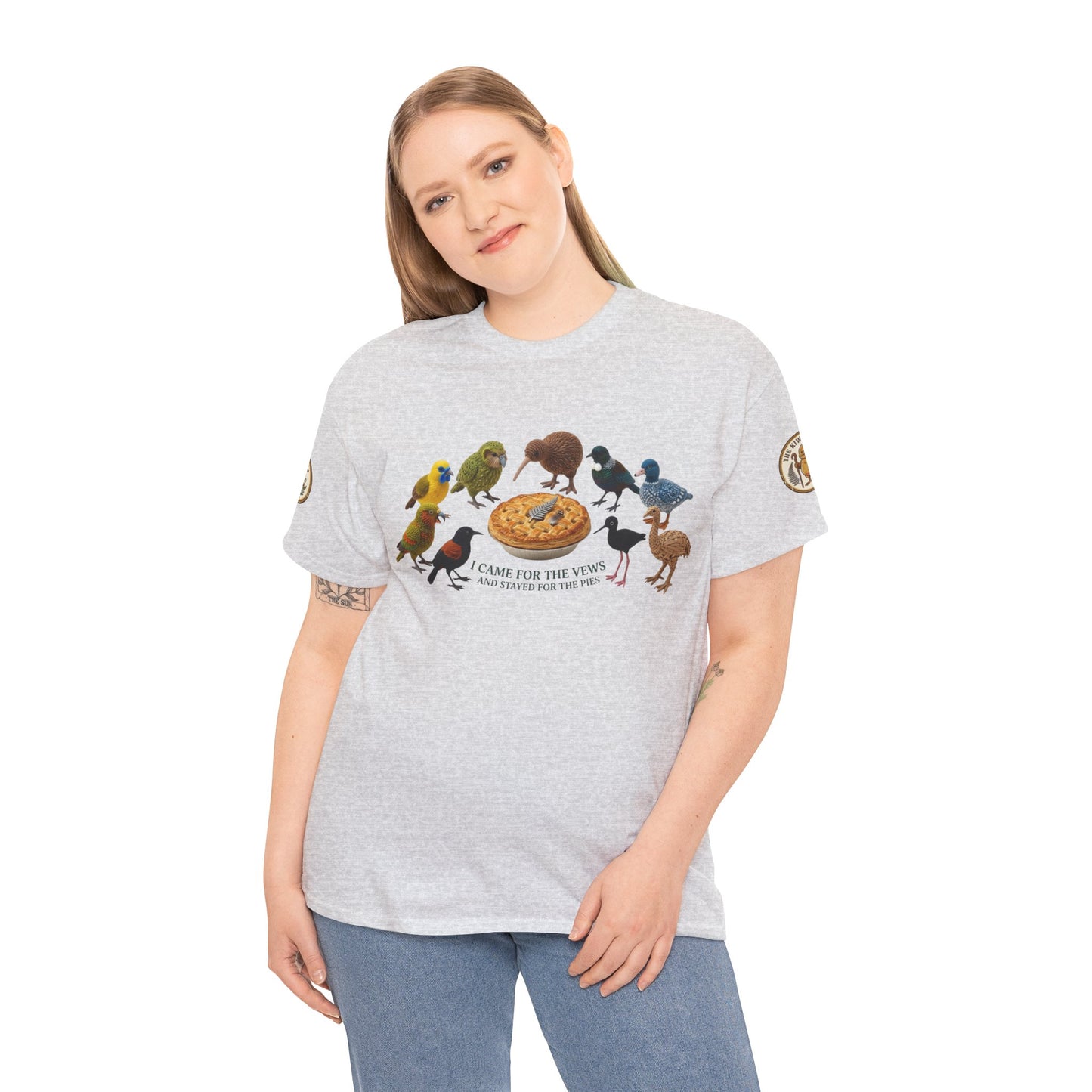 Heather gray T-shirt on model with front bird-and-pizza graphic and sleeve logo patch.