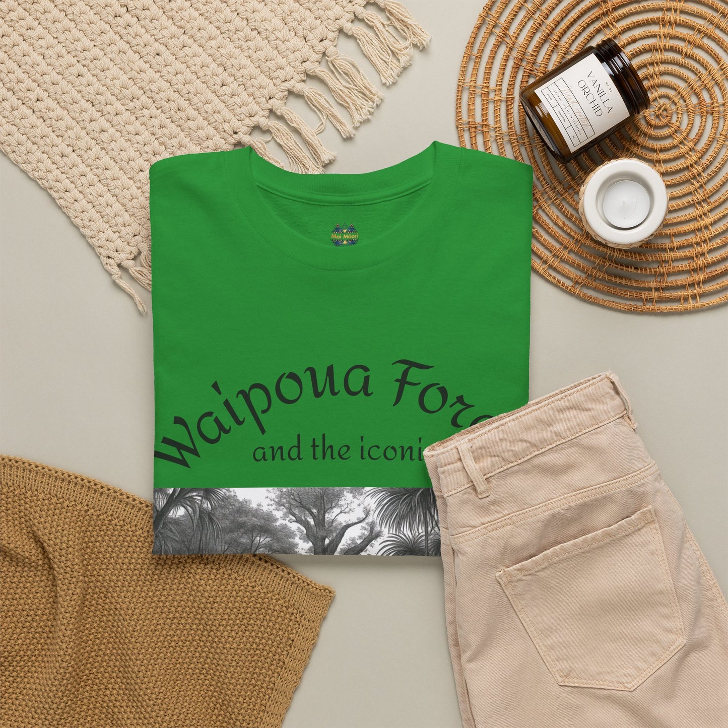 Green graphic T-shirt with forest artwork and “Waipoua Forest” text on front
