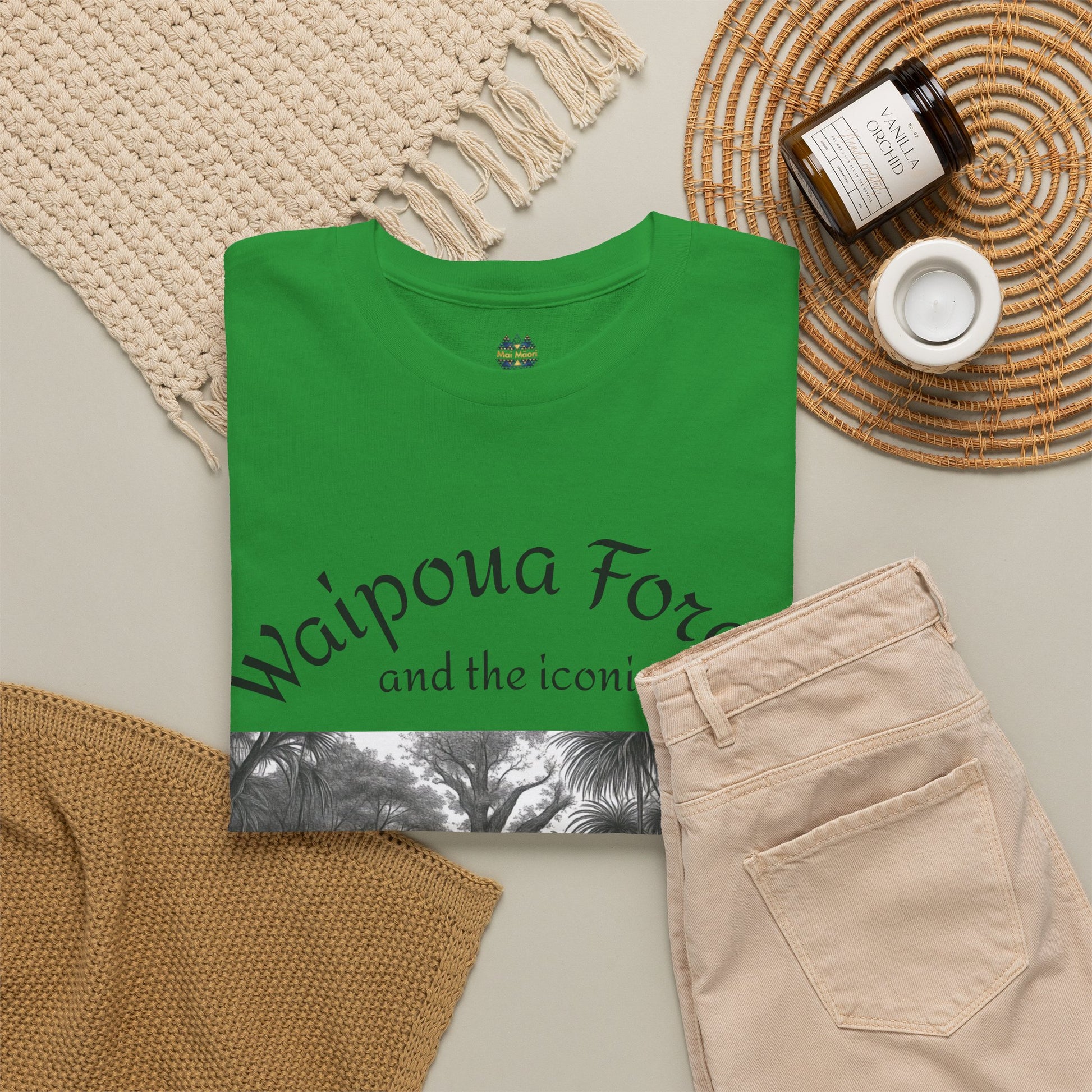 Green graphic T-shirt with forest artwork and “Waipoua Forest” text on front