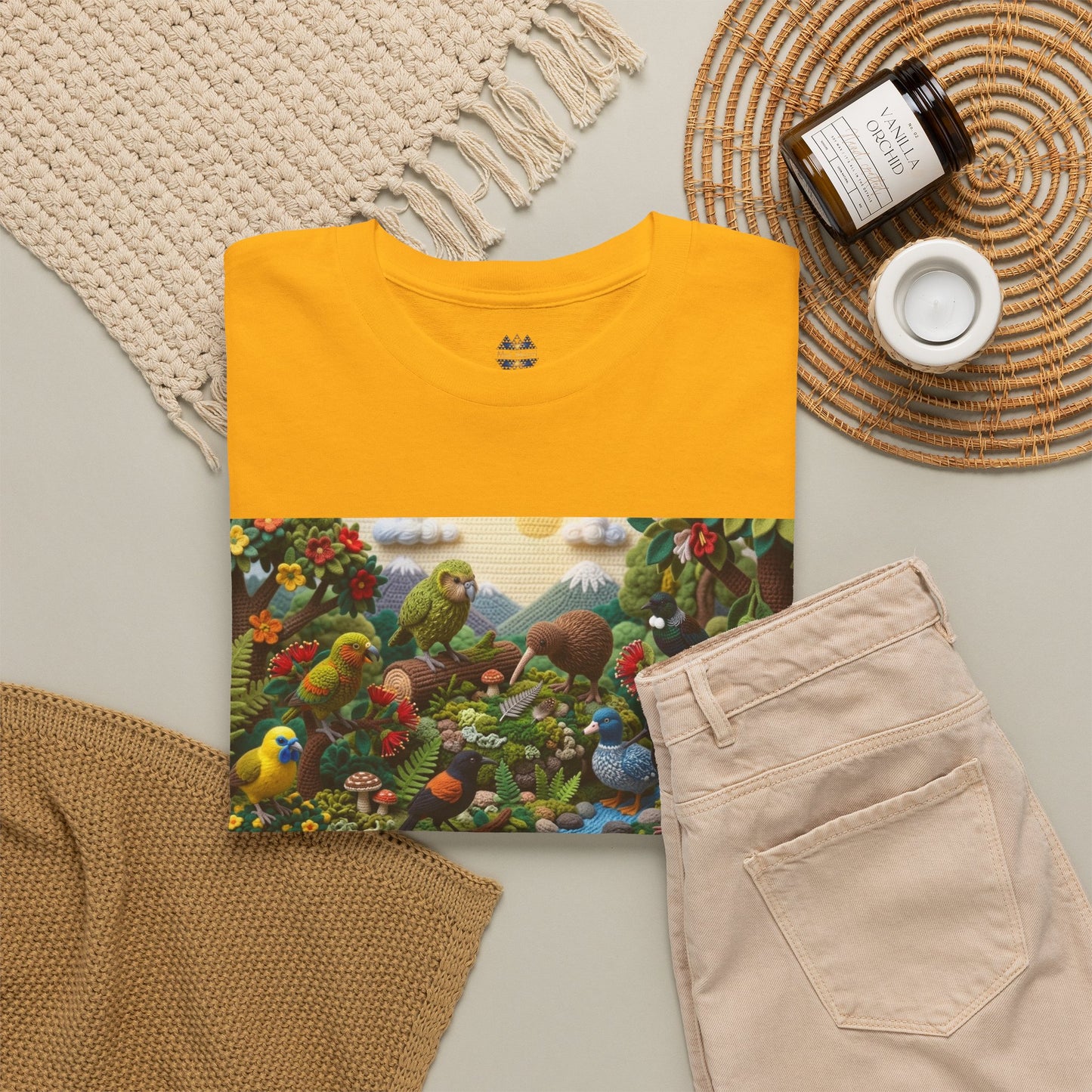 Mustard yellow graphic T-shirt with colorful bird landscape front panel