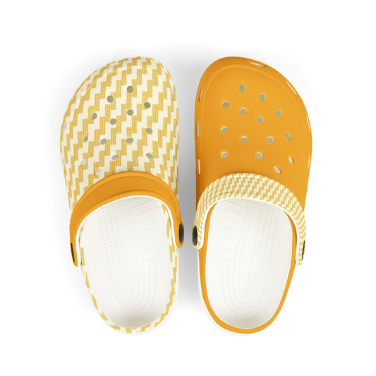 Pair of white clogs with mustard straps, chevron knit, and perforated holes