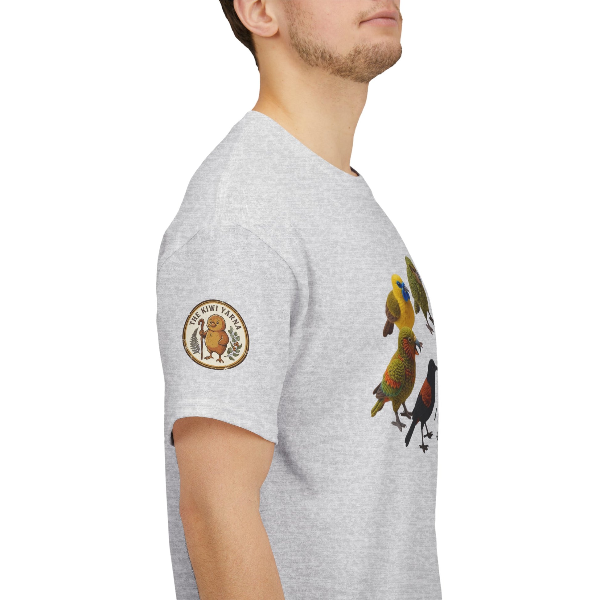 Heather gray T-shirt side view with circular sleeve logo and colorful bird graphic.
