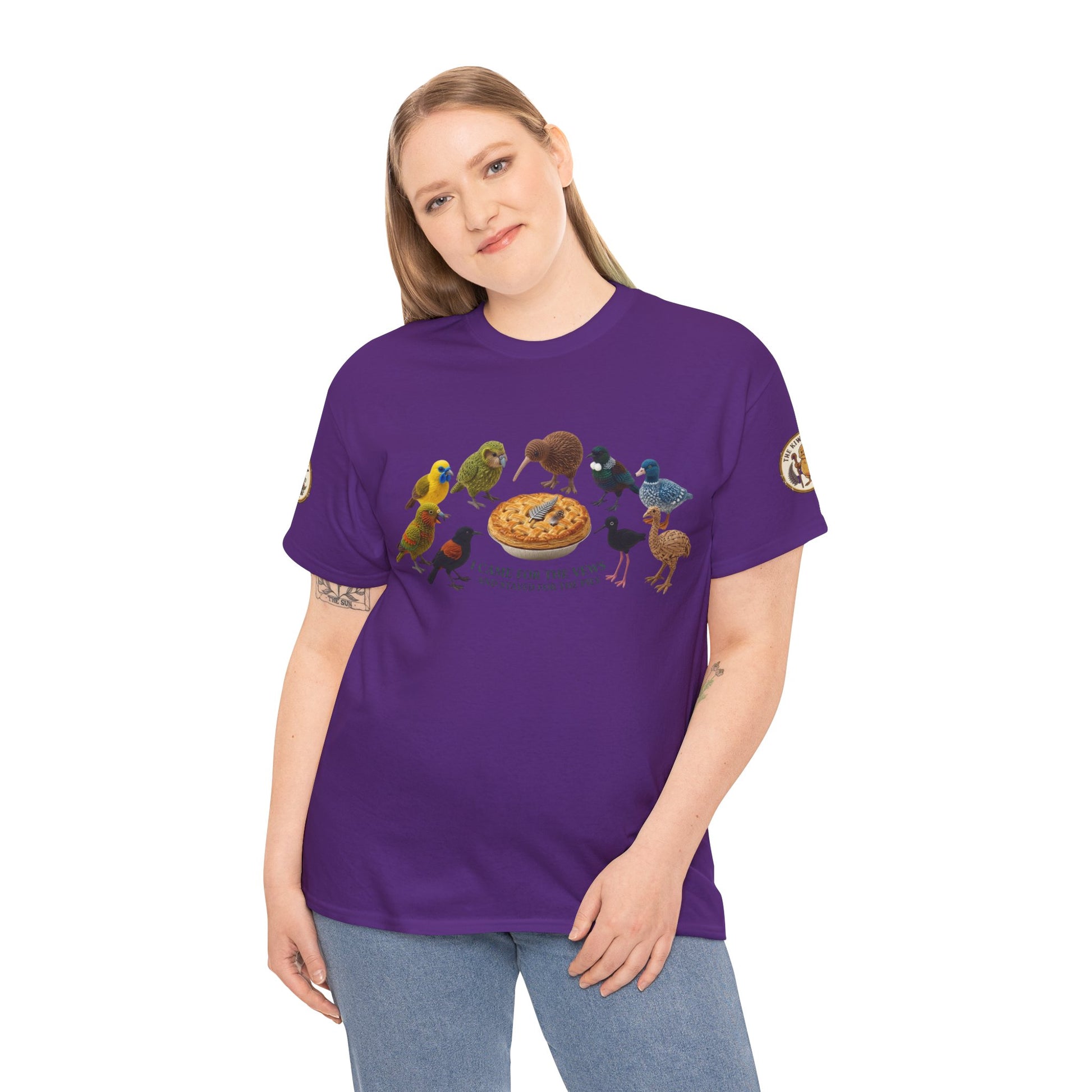 Purple graphic T-shirt on model with birds and pie-style emblem