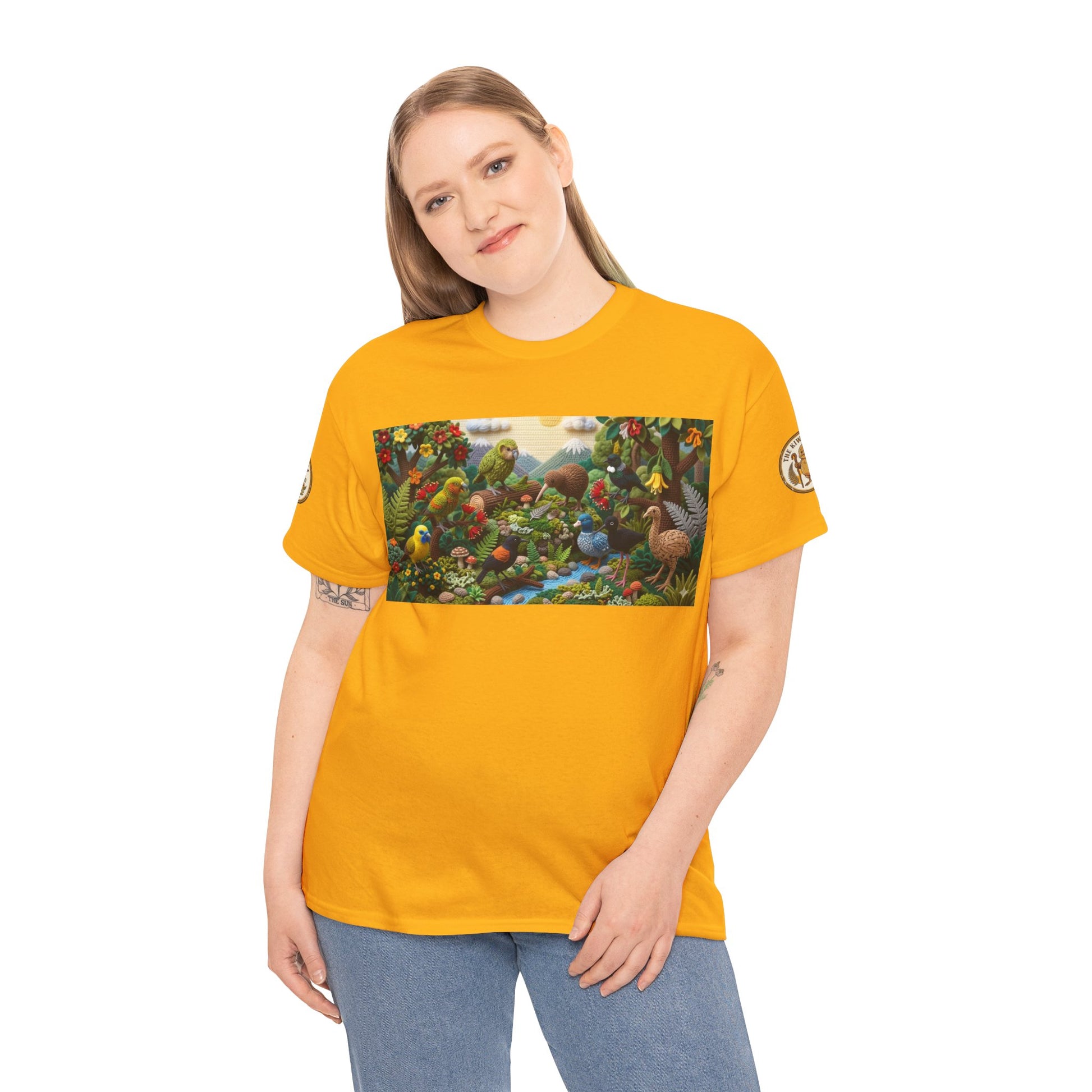 Mustard yellow crew-neck t-shirt worn with colorful bird-and-forest graphic across chest