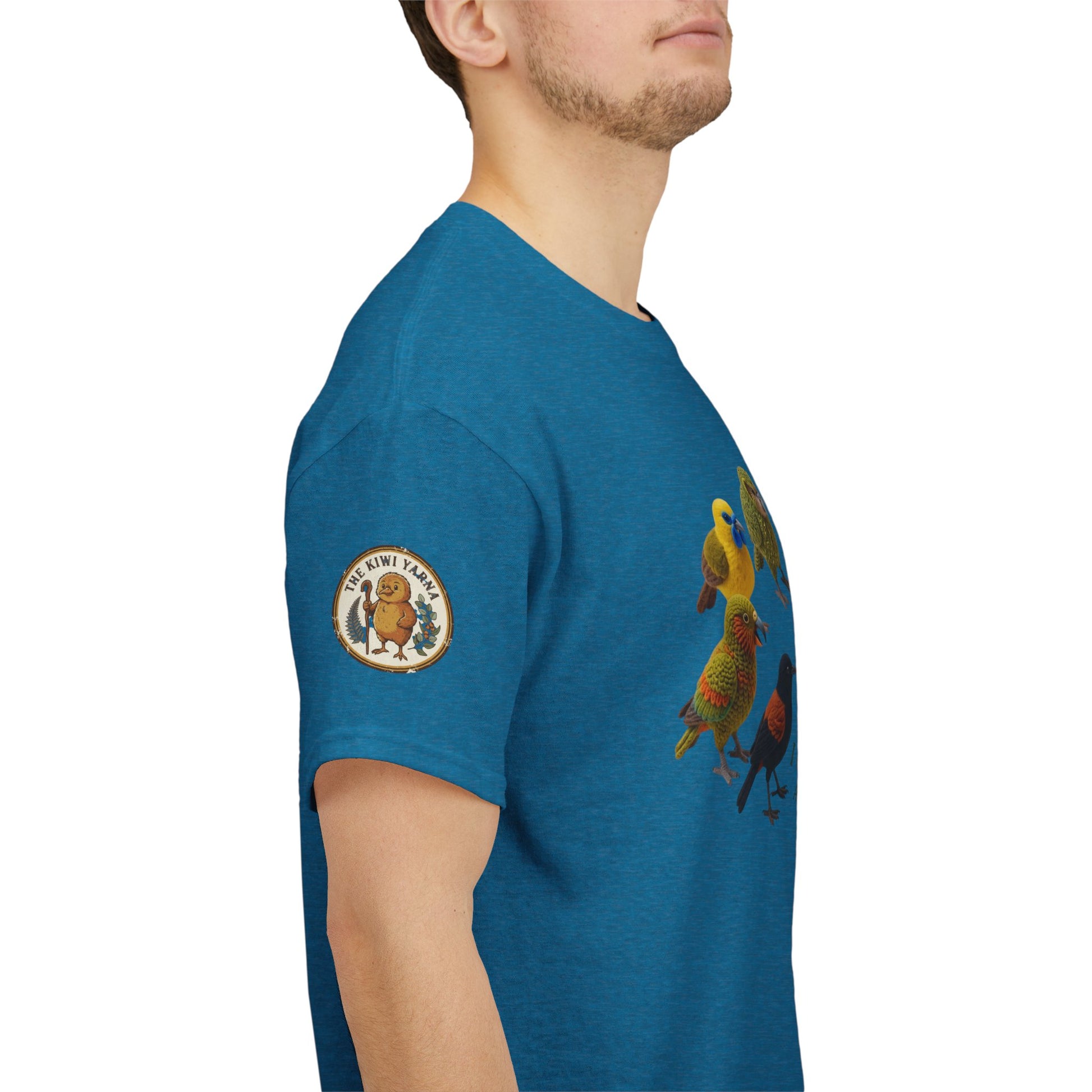 Blue graphic T-shirt with bird illustration and round sleeve patch on the sleeve