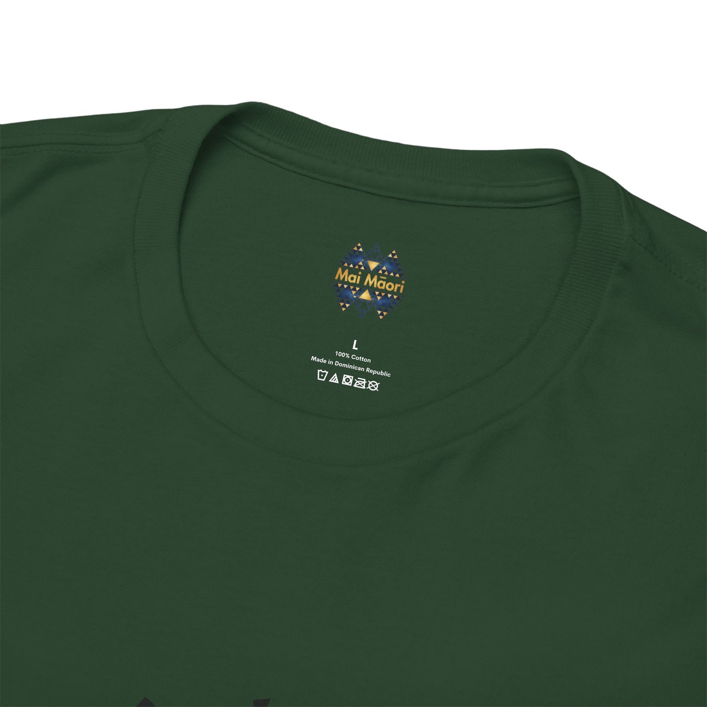 Green T-shirt close-up showing small chest logo and neckline.