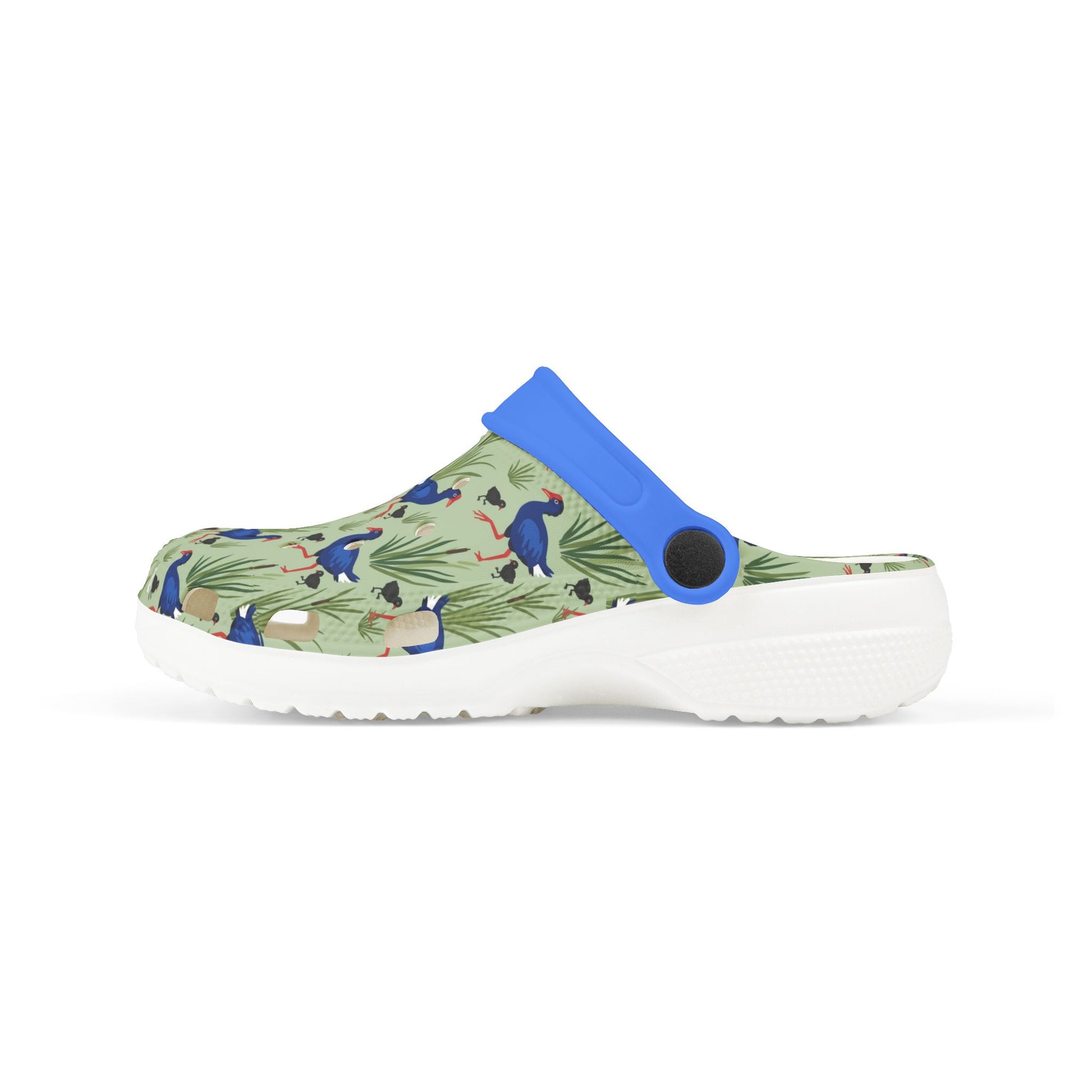 Kids clog shoes with green animal print upper and blue heel strap, white sole.
